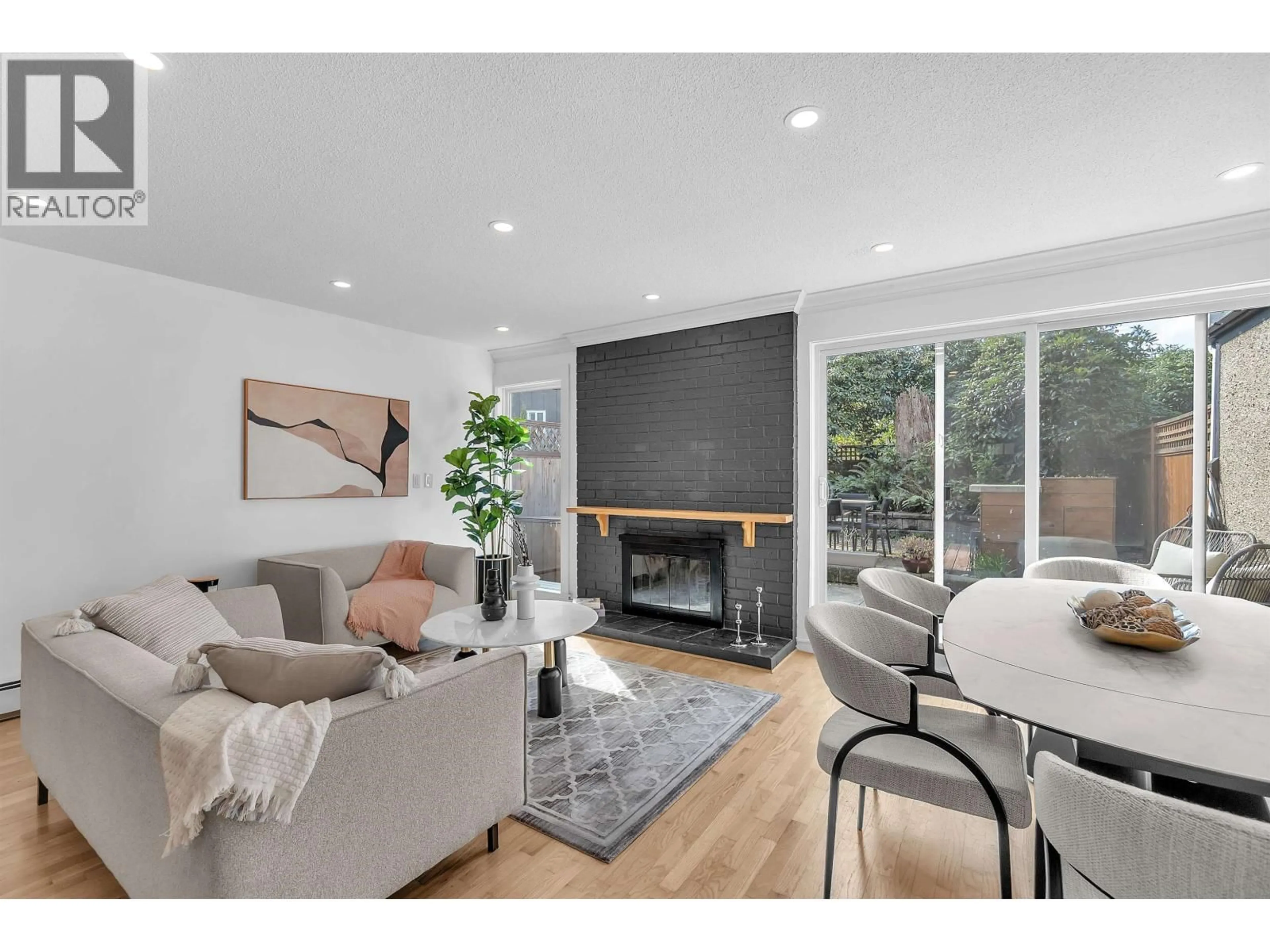 Living room with furniture, wood/laminate floor for 802 - 555 28TH STREET, North Vancouver British Columbia V7N2J7