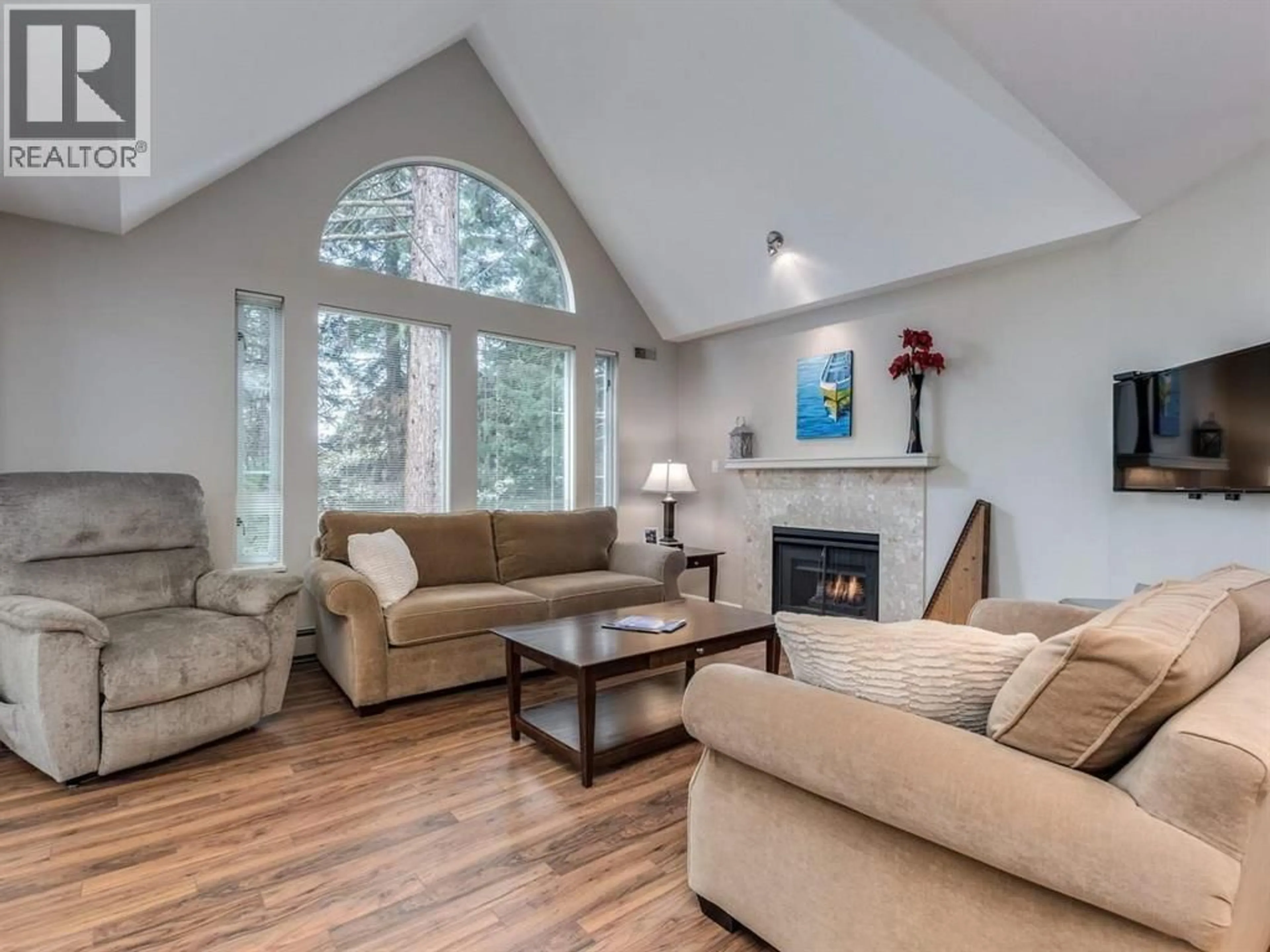 Living room with furniture, wood/laminate floor for 304 - 1675 AUGUSTA AVENUE, Burnaby British Columbia V5A4S8