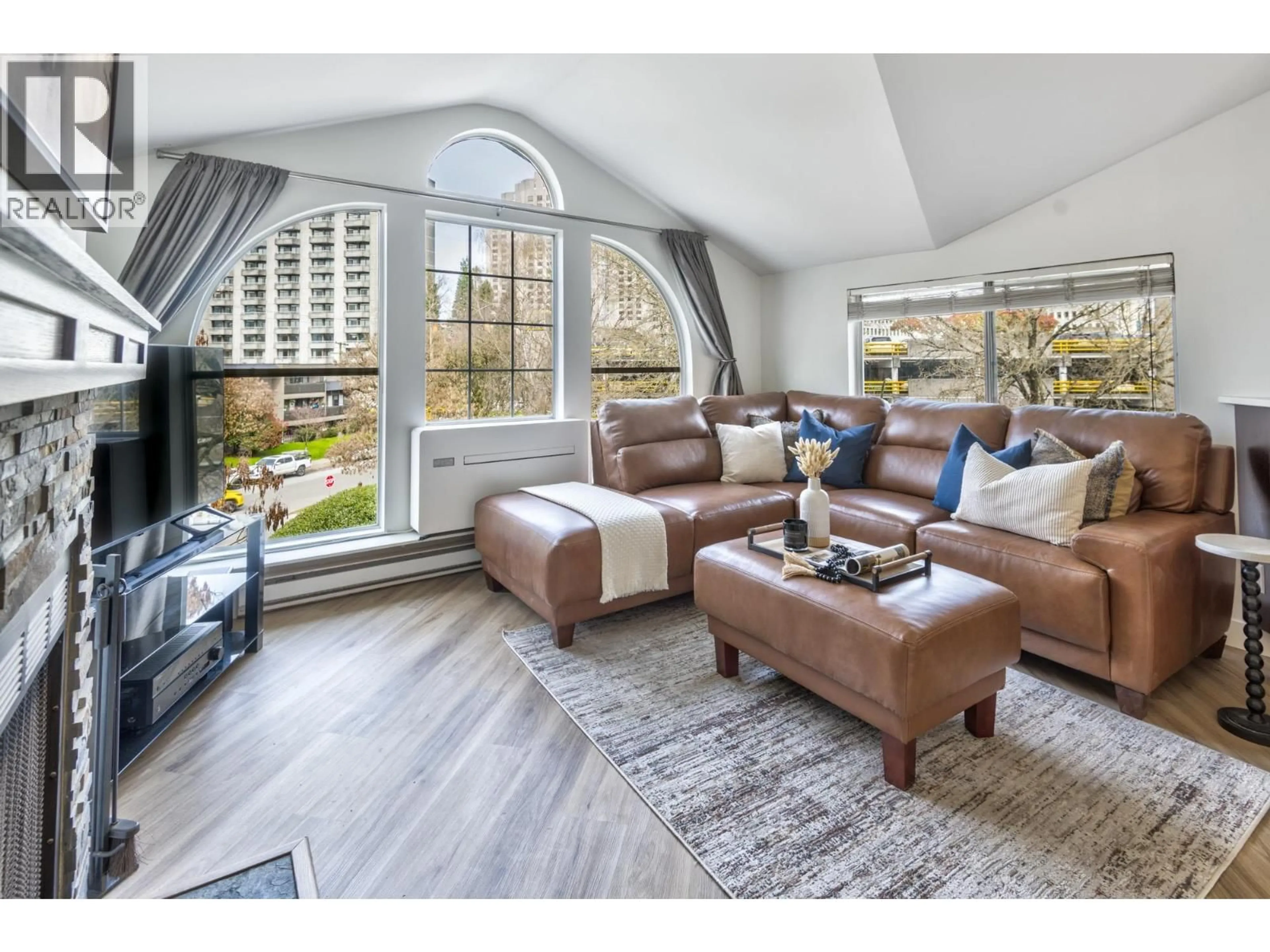 Living room with furniture, wood/laminate floor for 406 - 888 13TH AVENUE, Vancouver British Columbia V5Z1P2