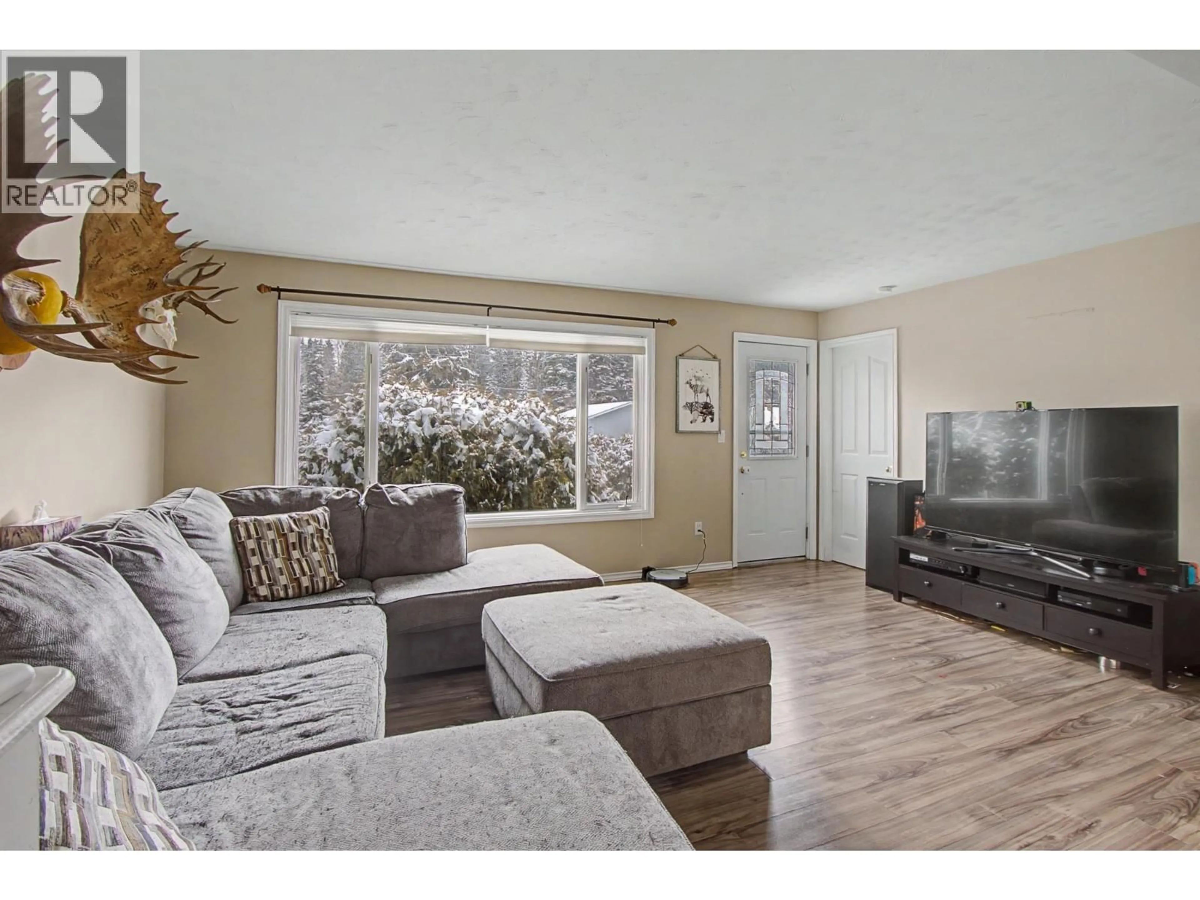 Living room with furniture, wood/laminate floor for 2422 MYTTING ROAD, Prince George British Columbia V2K1R7