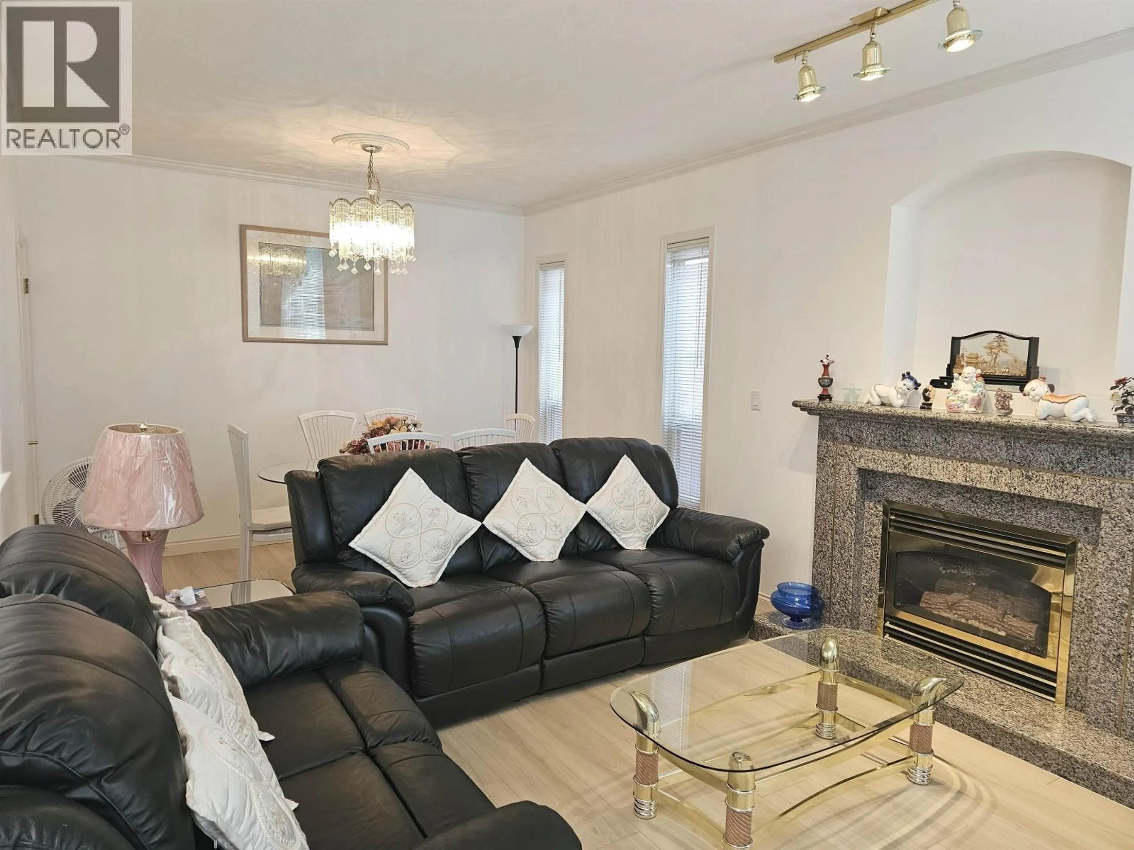 Living room with furniture, wood/laminate floor for 6 - 8693 NO. 3 ROAD, Richmond British Columbia V6Y2E6