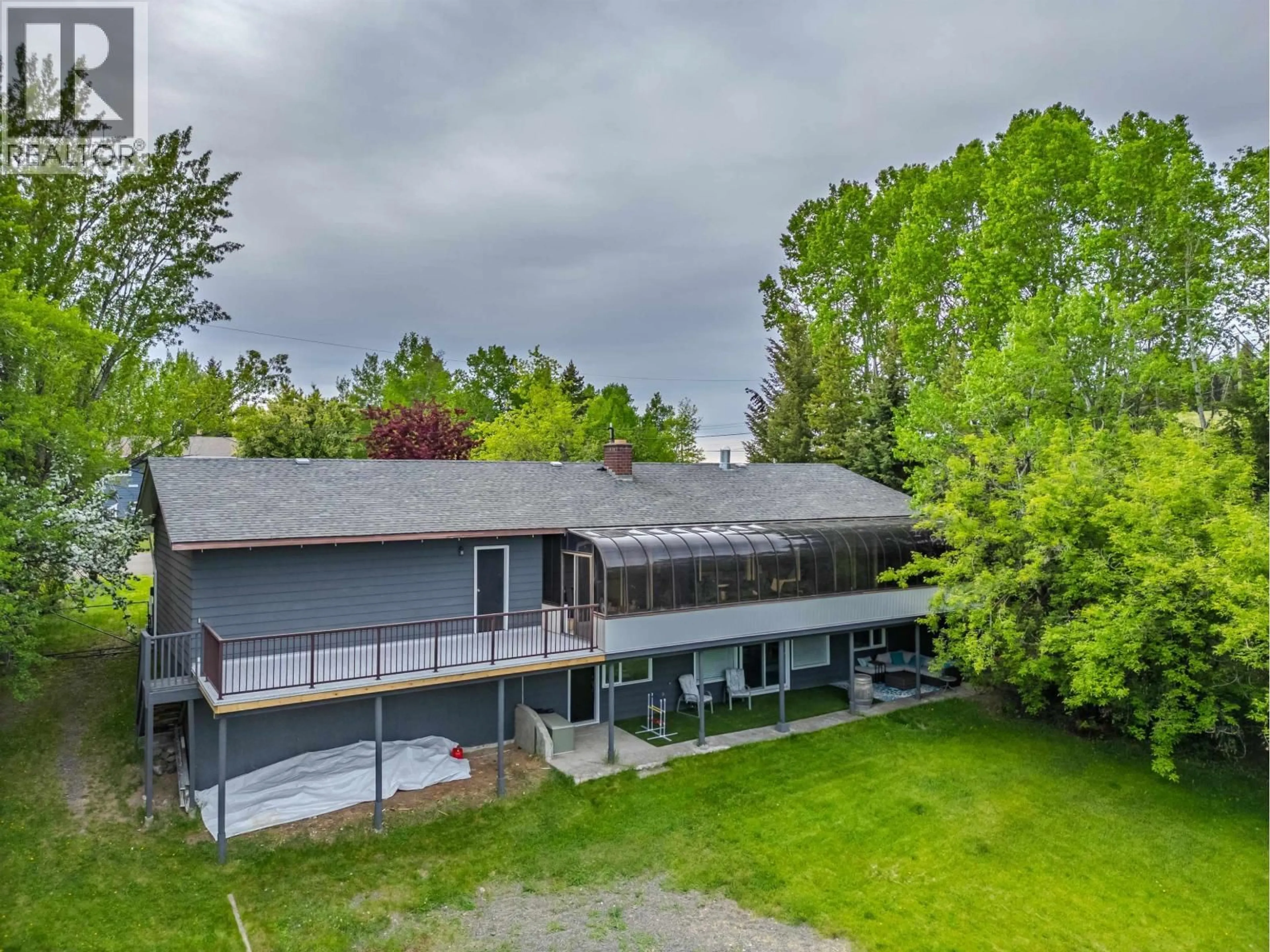 A pic from outside/outdoor area/front of a property/back of a property/a pic from drone, unknown for 4715 PARKER COURT, 108 Mile Ranch British Columbia V0K2Z0