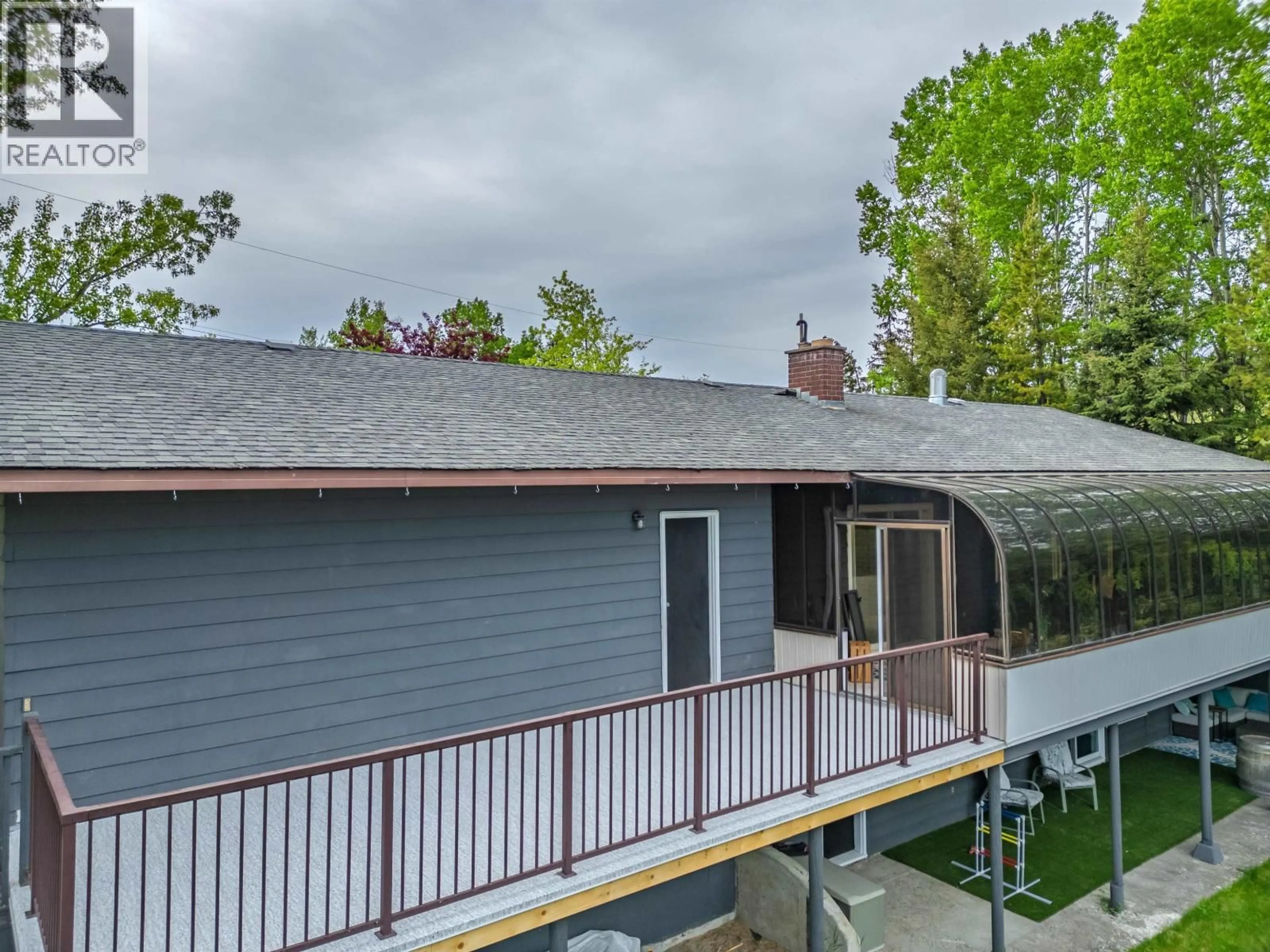 A pic from outside/outdoor area/front of a property/back of a property/a pic from drone, unknown for 4715 PARKER COURT, 108 Mile Ranch British Columbia V0K2Z0