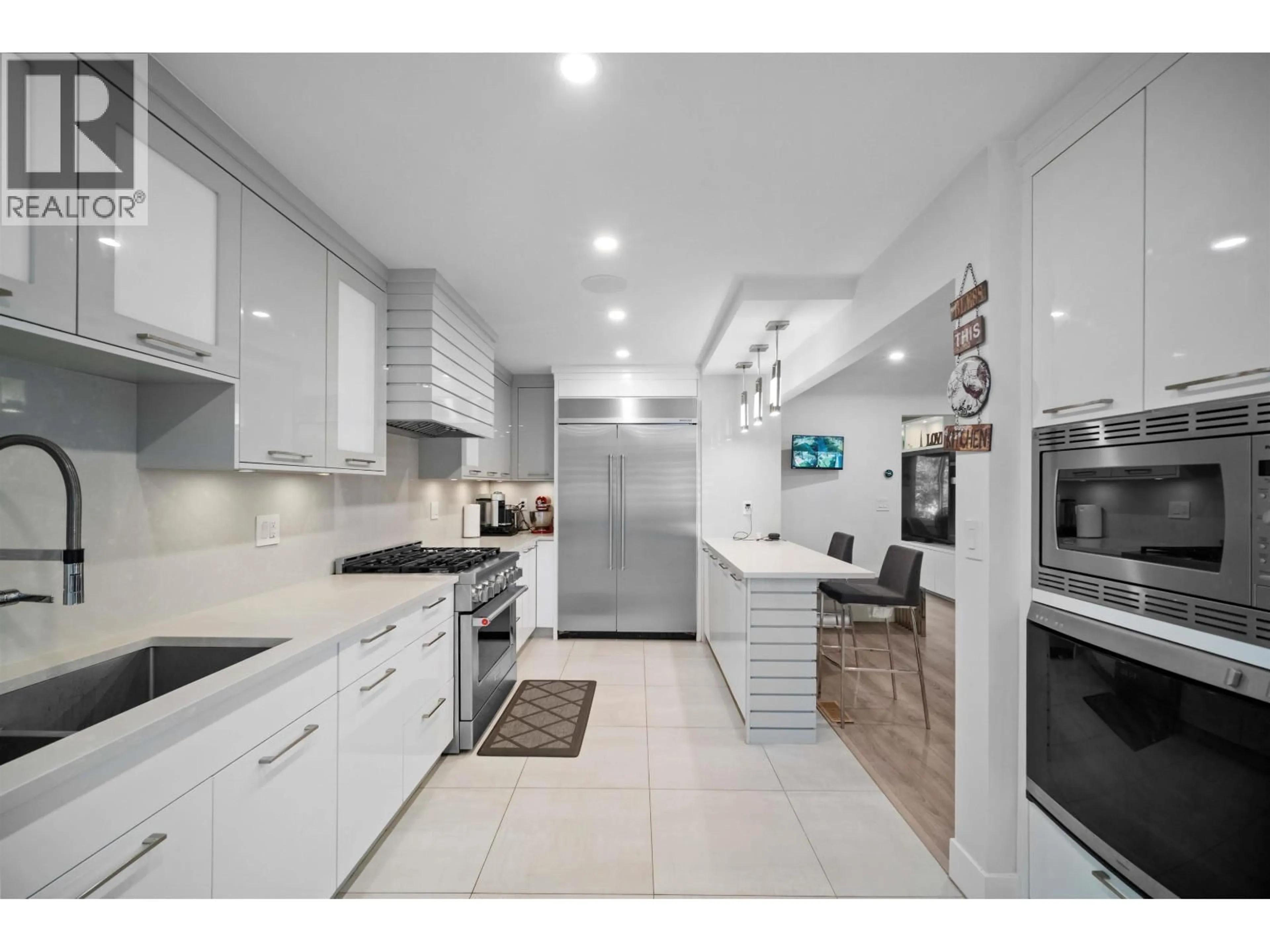 Open concept kitchen, ceramic/tile floor for 6978 MCKINNON STREET, Vancouver British Columbia V5S3G5