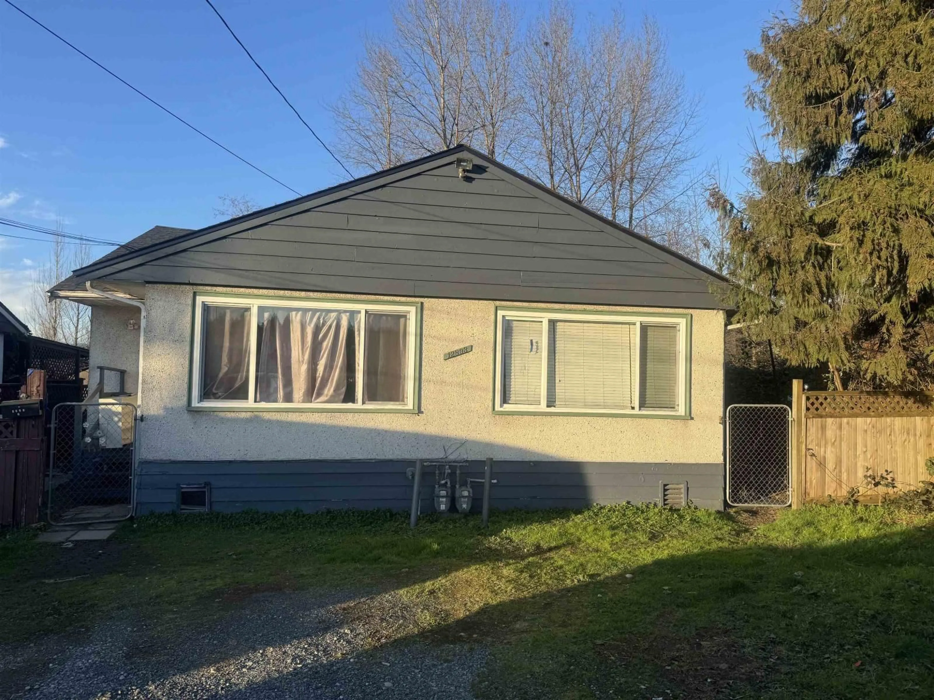 Home with vinyl exterior material, street for 12893 114A AVENUE, Surrey British Columbia V3R2N1