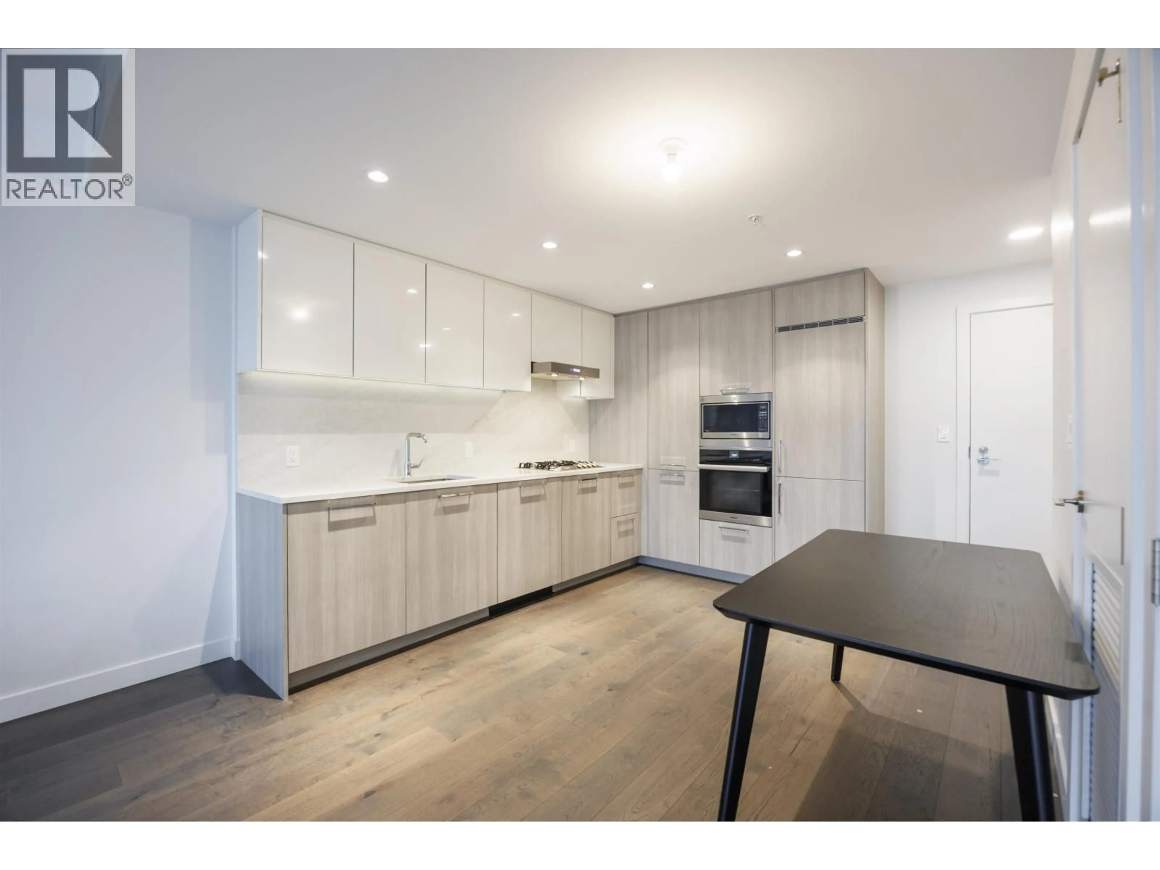 Open concept kitchen, wood/laminate floor for 806 - 8155 CAPSTAN WAY, Richmond British Columbia V6X0V3