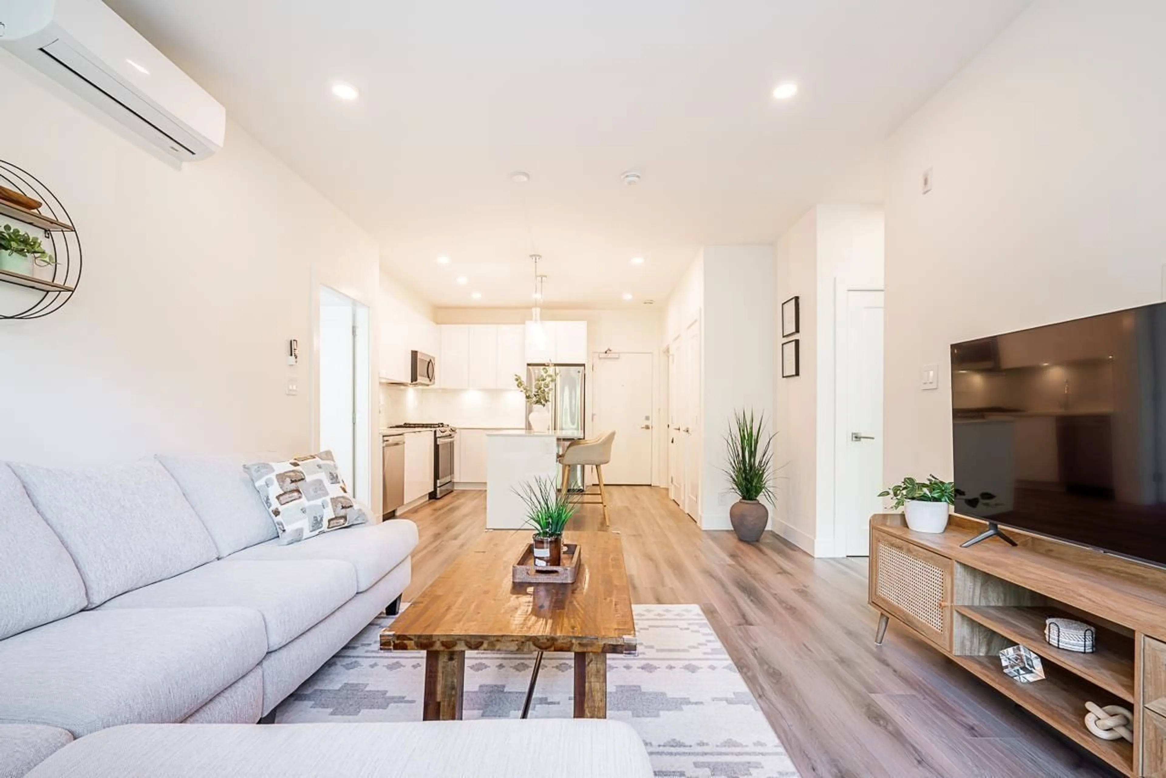 Living room with furniture, wood/laminate floor for B311 - 8447 202 STREET, Langley British Columbia V2Y2B7