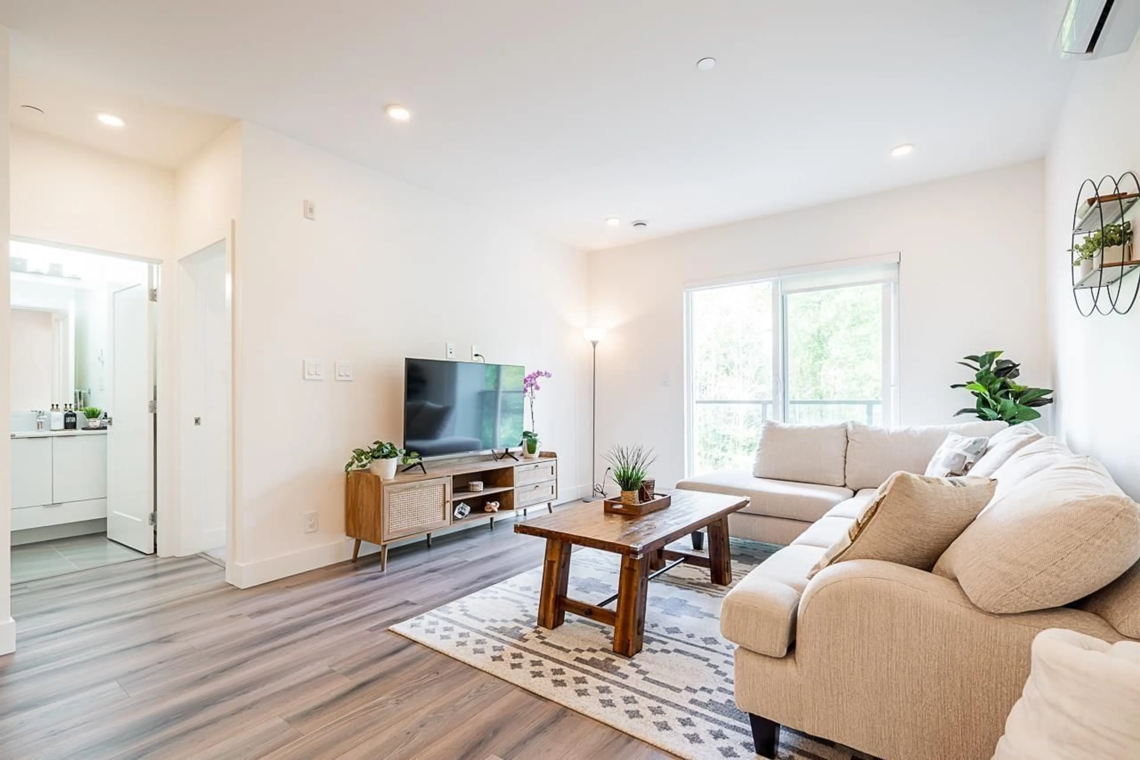 Living room with furniture, wood/laminate floor for B311 - 8447 202 STREET, Langley British Columbia V2Y2B7