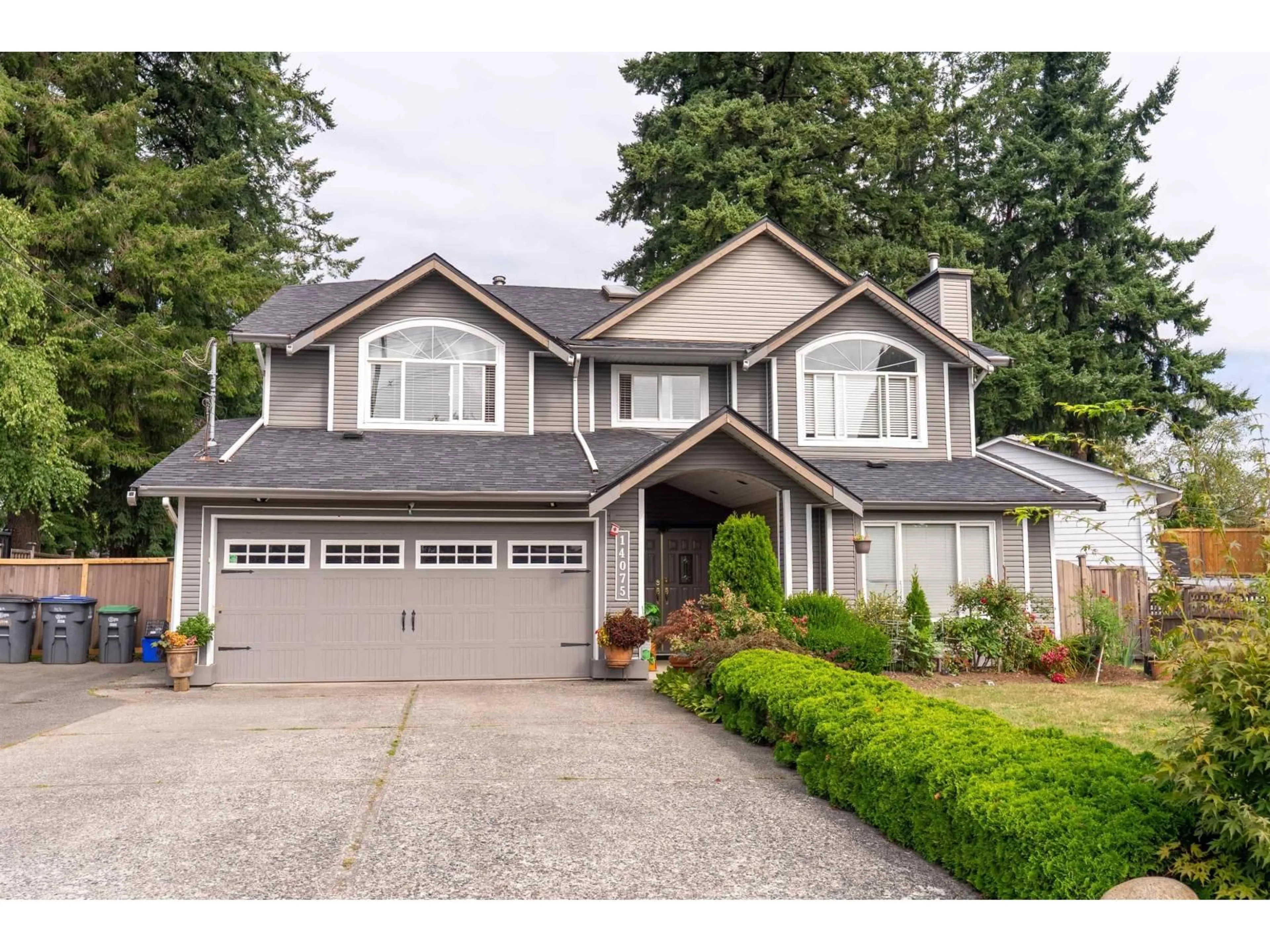 Home with vinyl exterior material, street for 14075 110A AVENUE, Surrey British Columbia V3R2B2