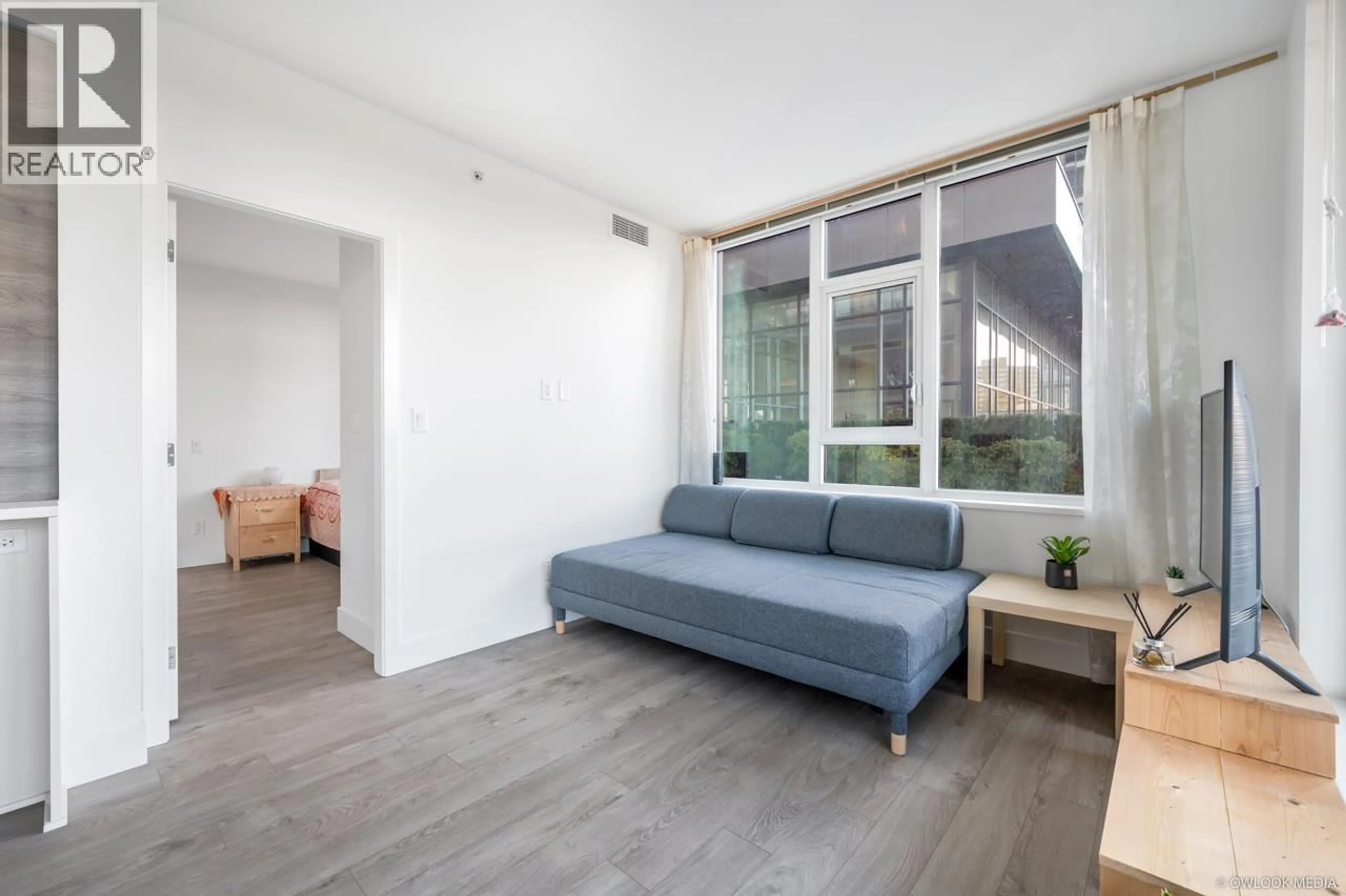 Living room with furniture, unknown for 402 - 7303 NOBLE LANE, Burnaby British Columbia V3N0H2