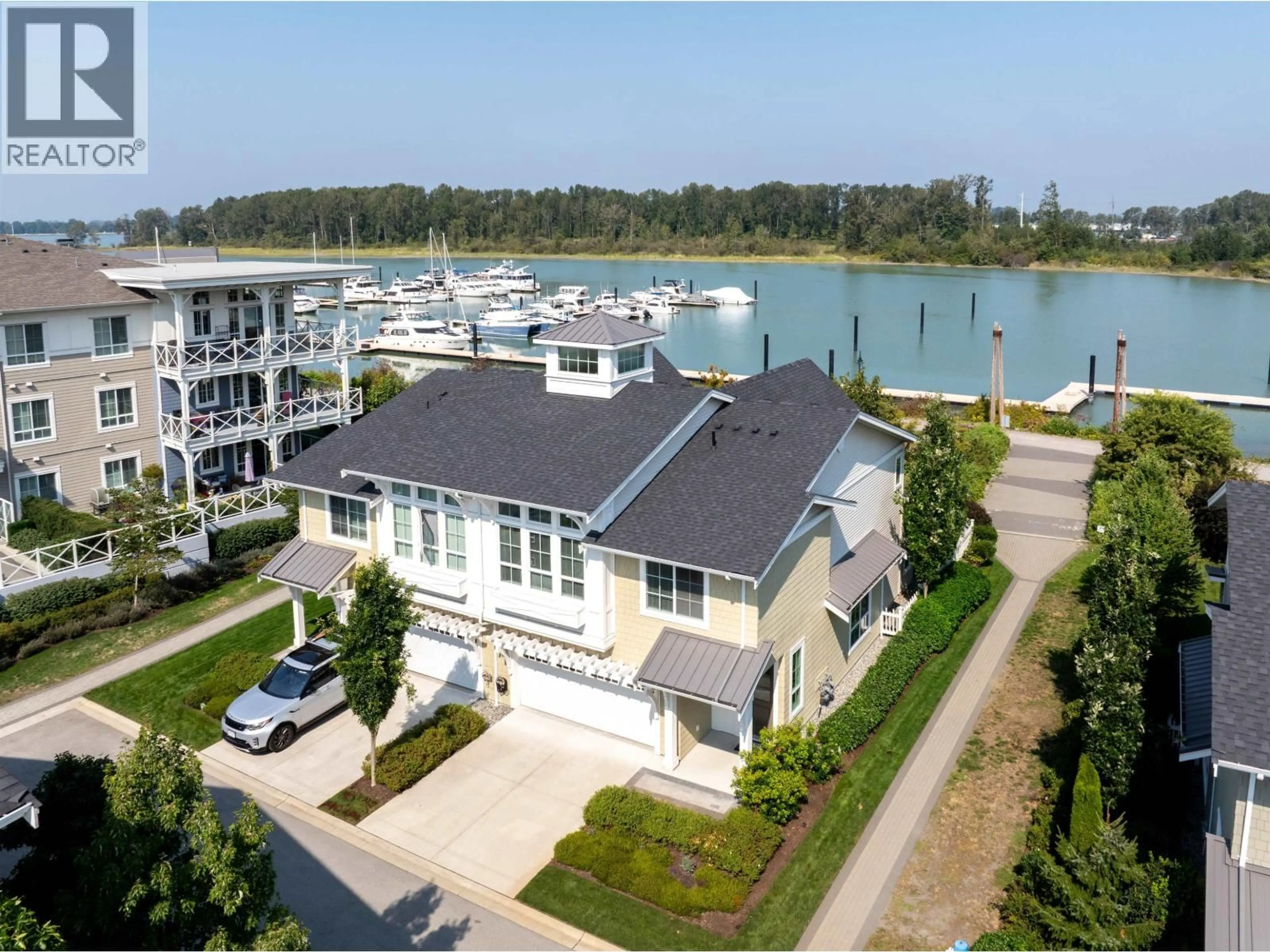 A pic from outside/outdoor area/front of a property/back of a property/a pic from drone, water/lake/river/ocean view for 2 - 5551 ADMIRAL WAY, Delta British Columbia V4K0C9