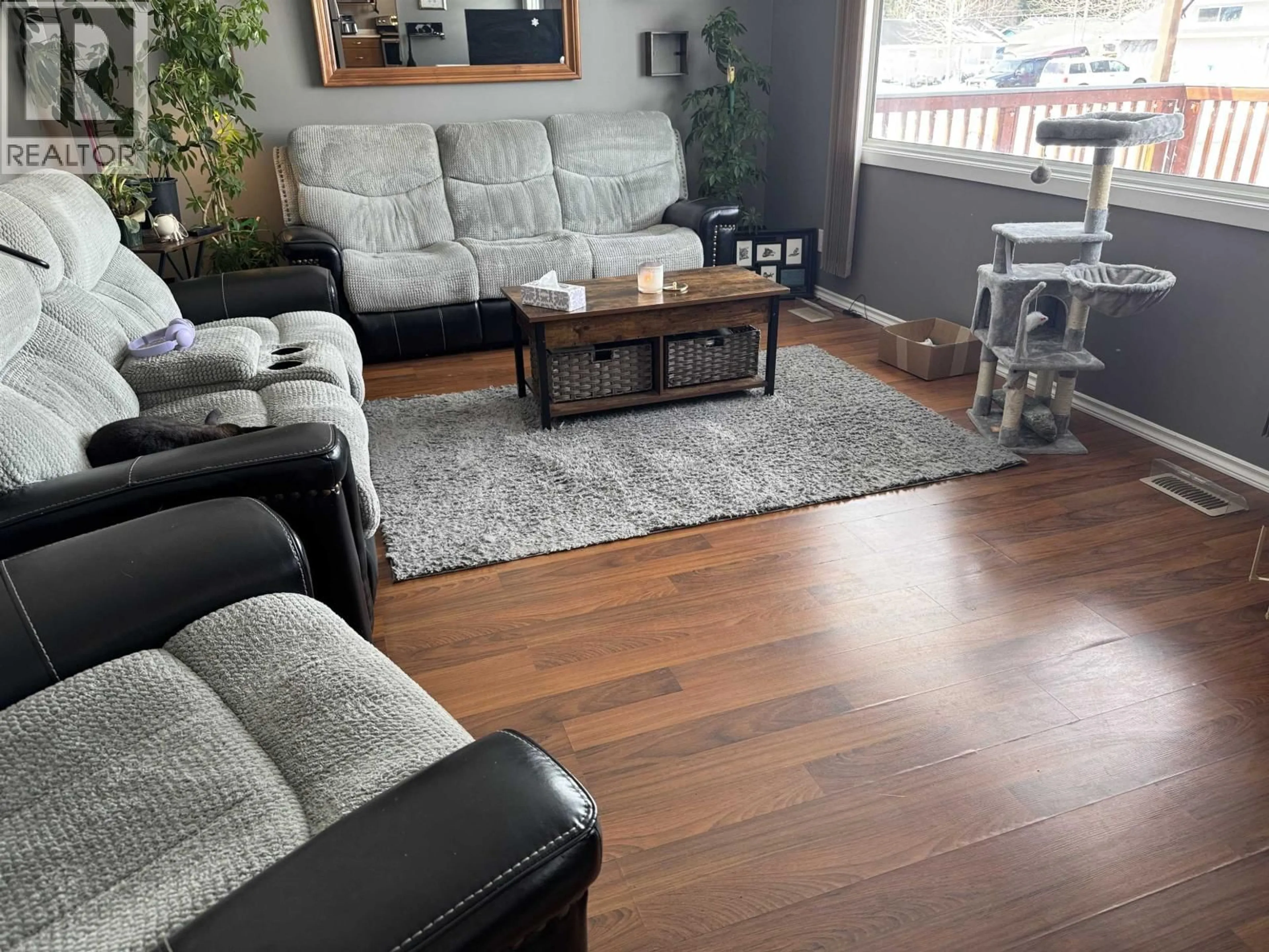 Living room with furniture, wood/laminate floor for 13 MANSON CRESCENT, Mackenzie British Columbia V0J2C0