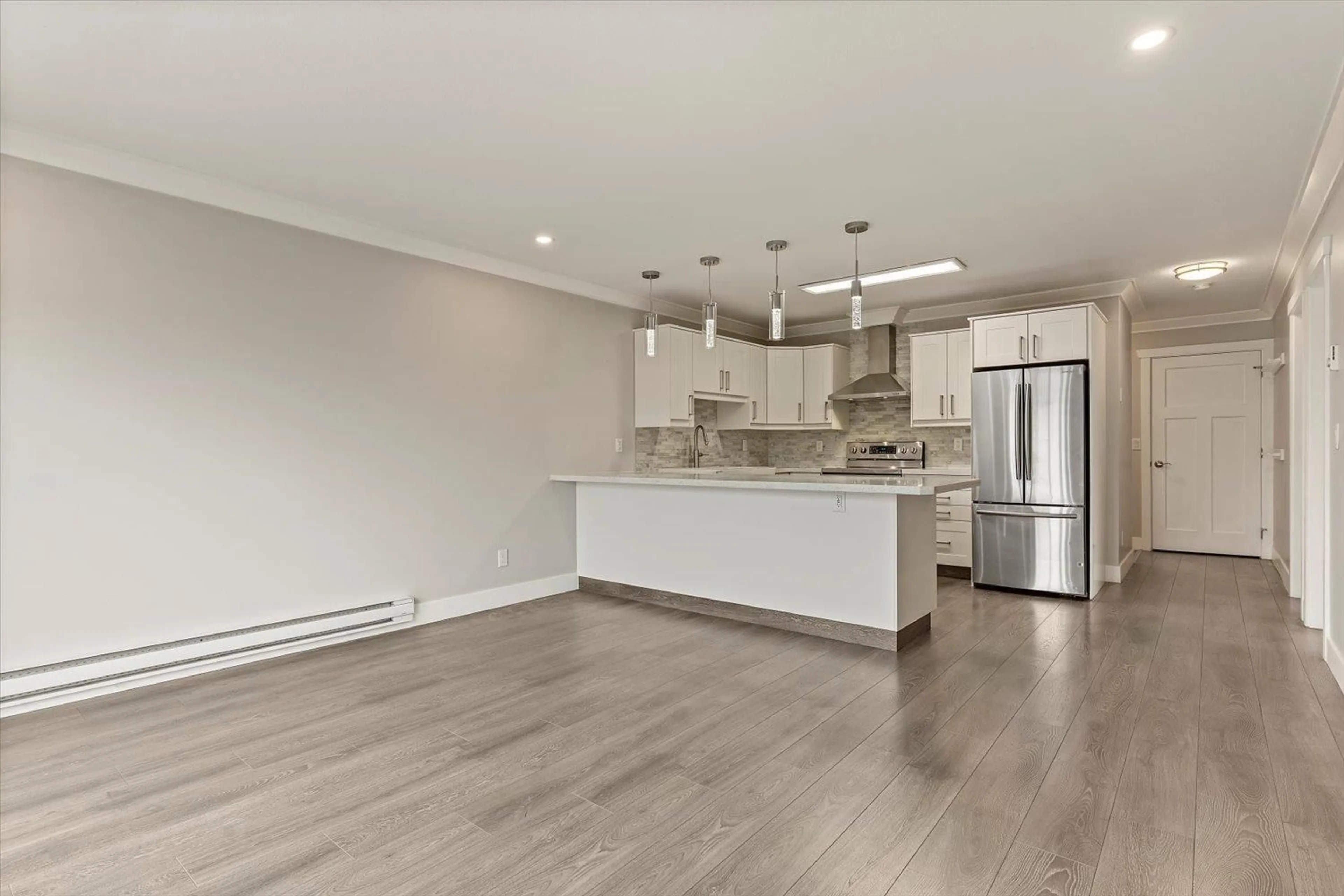 Open concept kitchen, wood/laminate floor for 207 - 45669 MCINTOSH DRIVE, Chilliwack British Columbia V2P6V4