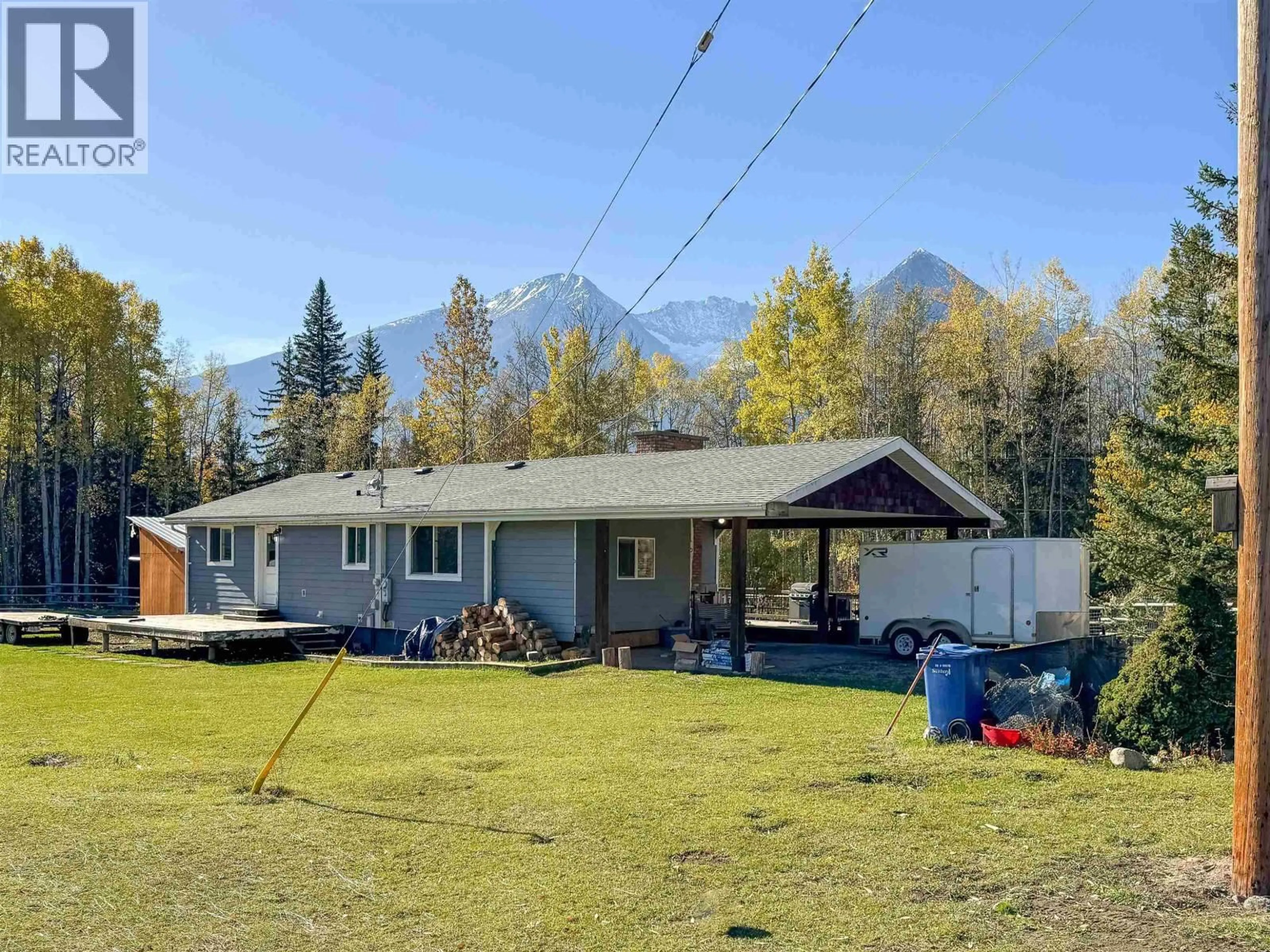 A pic from outside/outdoor area/front of a property/back of a property/a pic from drone, mountain view for 5933 RACEWAY ROAD, Smithers British Columbia V0J2N1