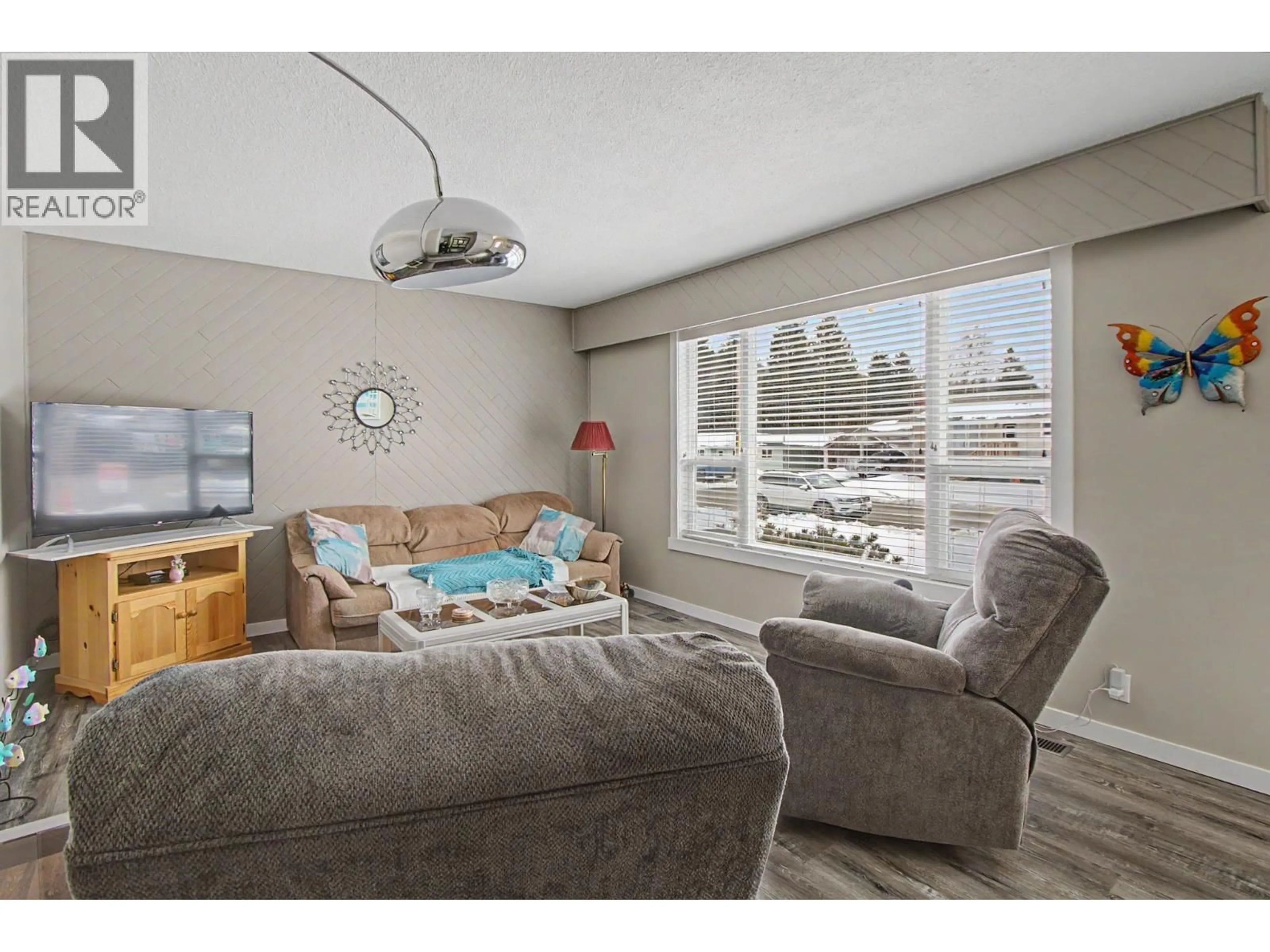 Living room with furniture, wood/laminate floor for 4244 CRAIG DRIVE, Prince George British Columbia V2K1E5