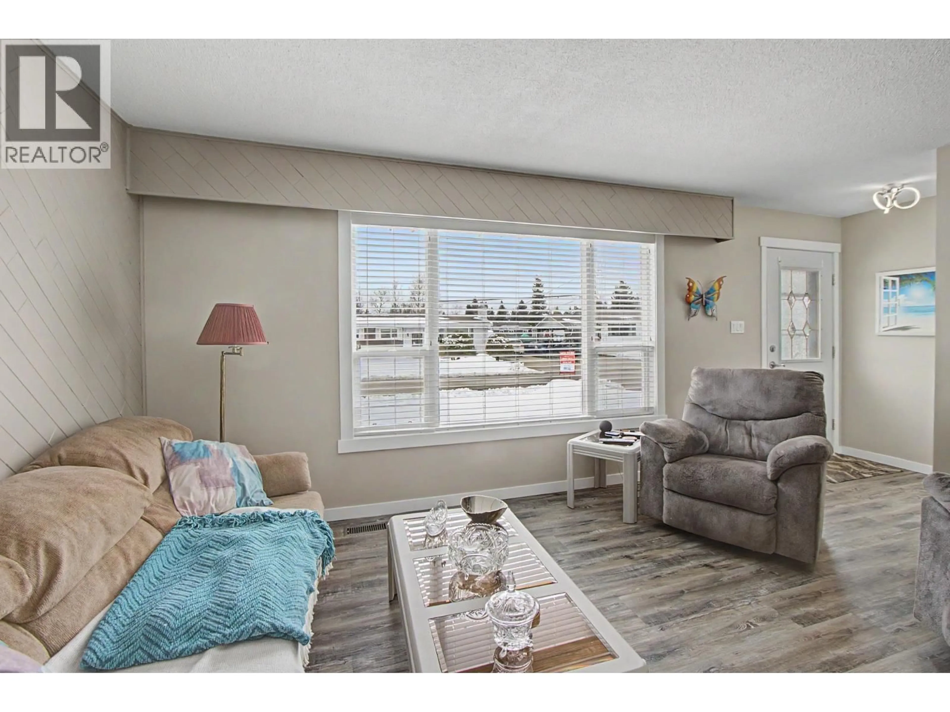 Living room with furniture, wood/laminate floor for 4244 CRAIG DRIVE, Prince George British Columbia V2K1E5