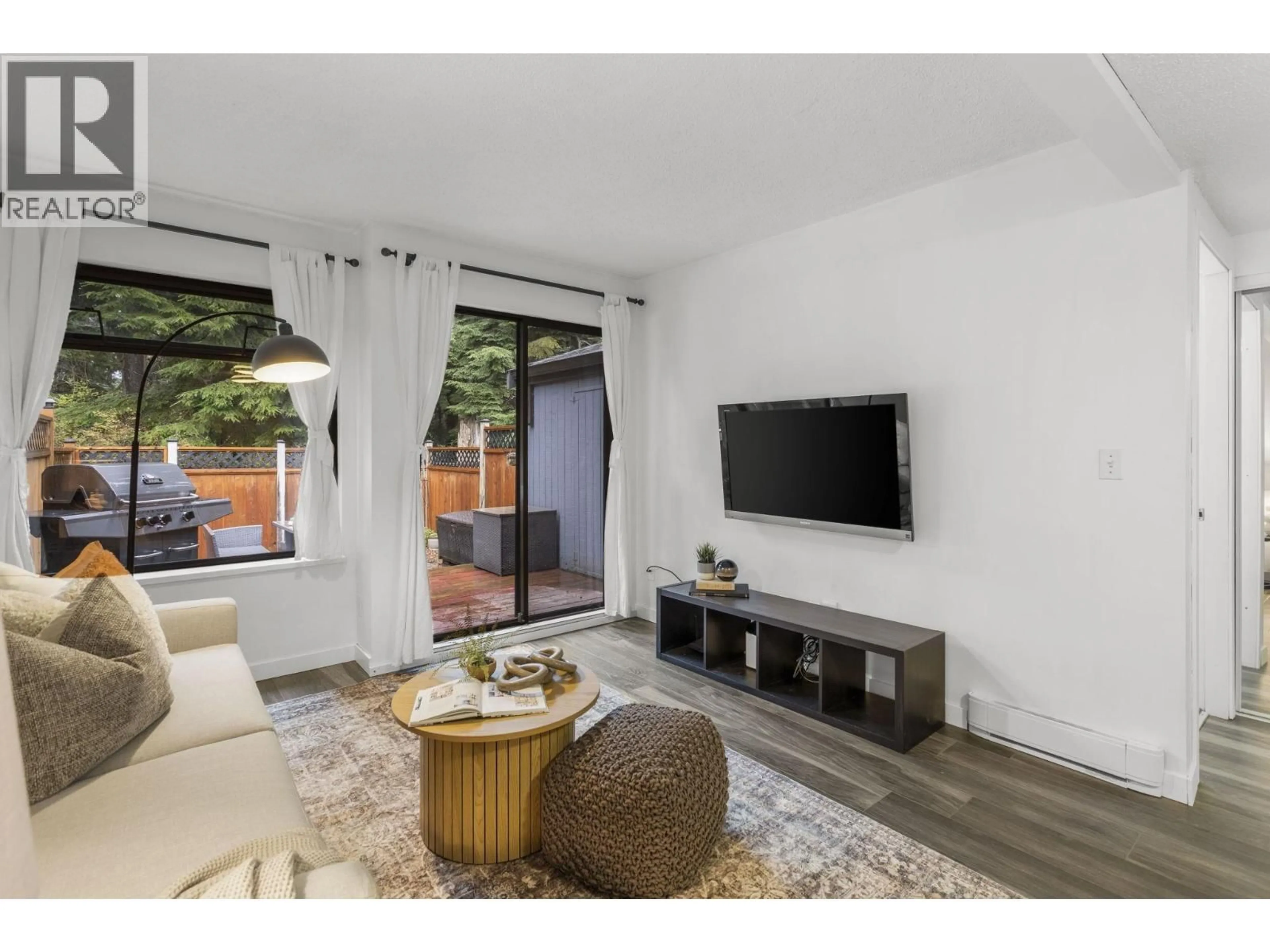 Living room with furniture, wood/laminate floor for 865 BLACKSTOCK ROAD, Port Moody British Columbia V3H3R9