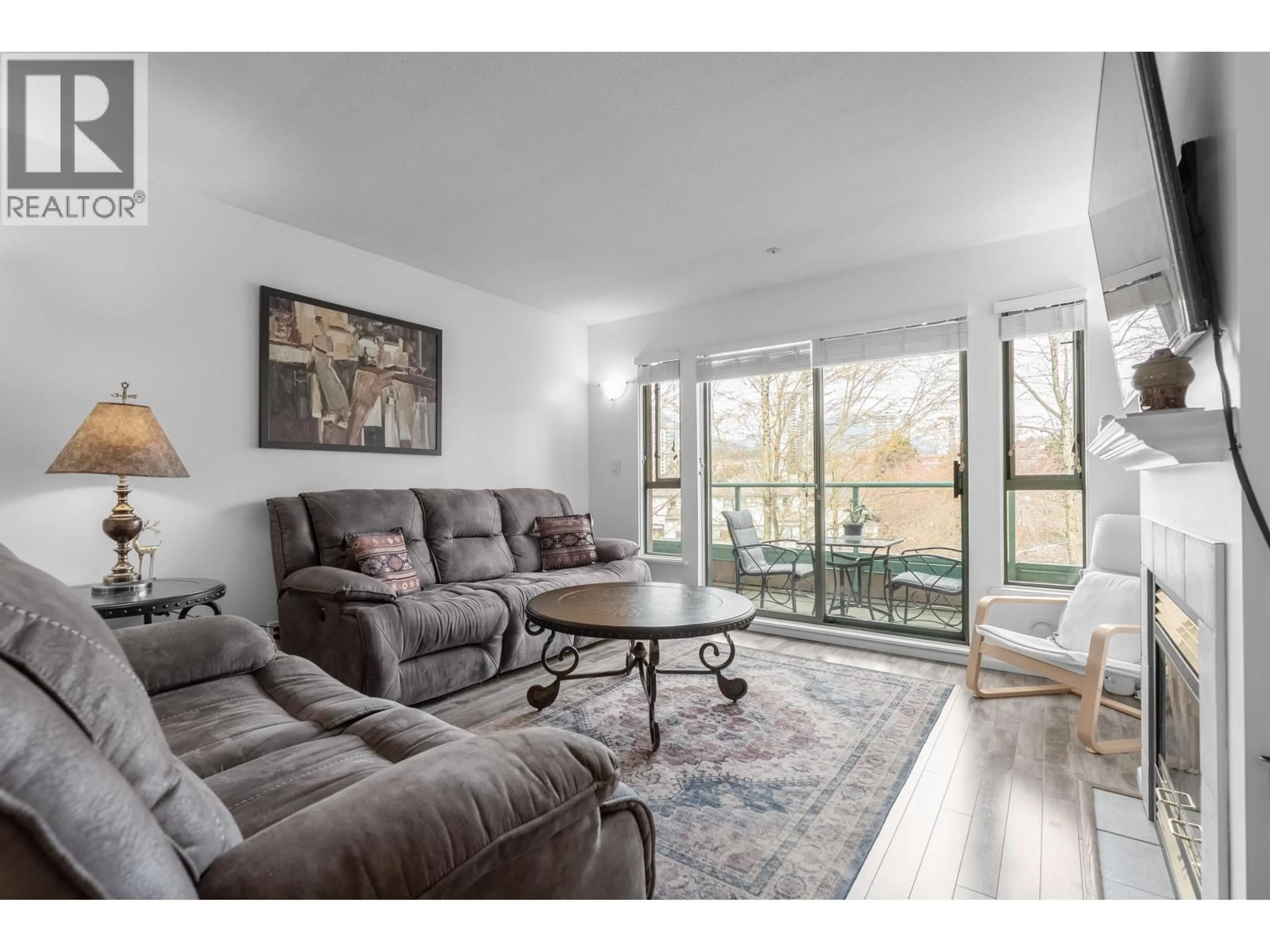 Living room with furniture, wood/laminate floor for P12 - 223 MOUNTAIN HIGHWAY, North Vancouver British Columbia V7J3V3