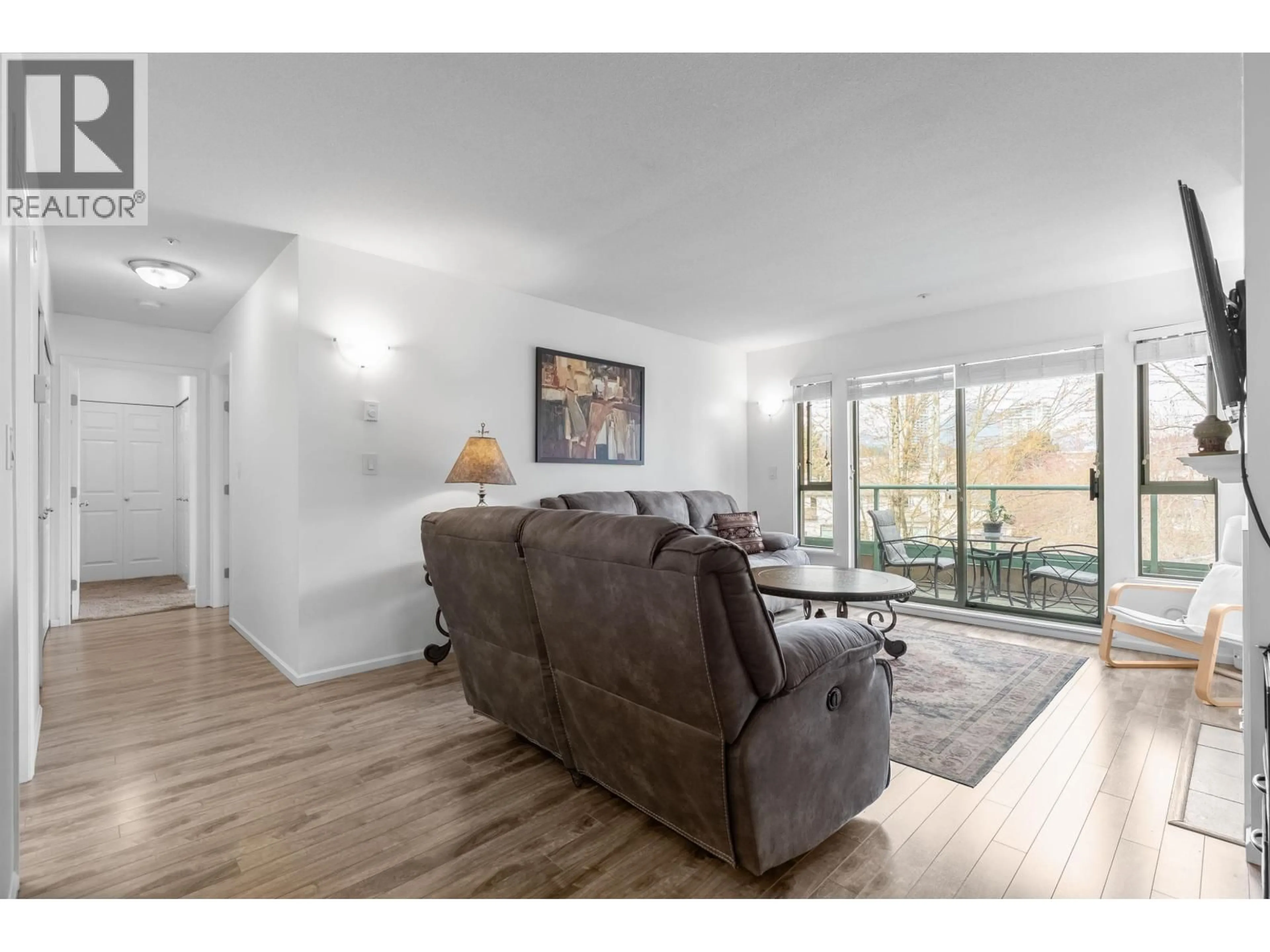 Living room with furniture, wood/laminate floor for P12 - 223 MOUNTAIN HIGHWAY, North Vancouver British Columbia V7J3V3