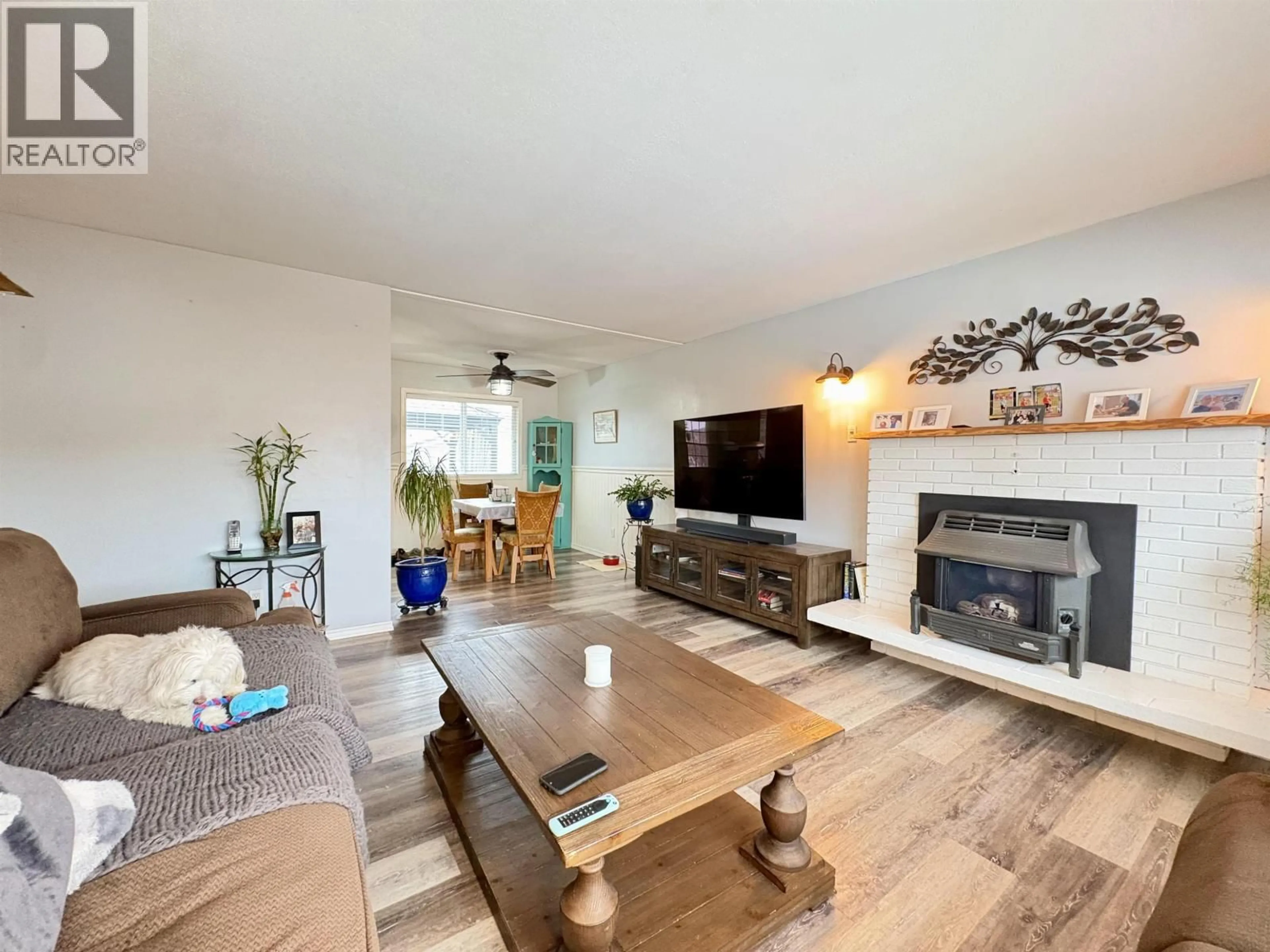 Living room with furniture, wood/laminate floor for 1443 JUBILEE AVENUE, Prince George British Columbia V2M4B3