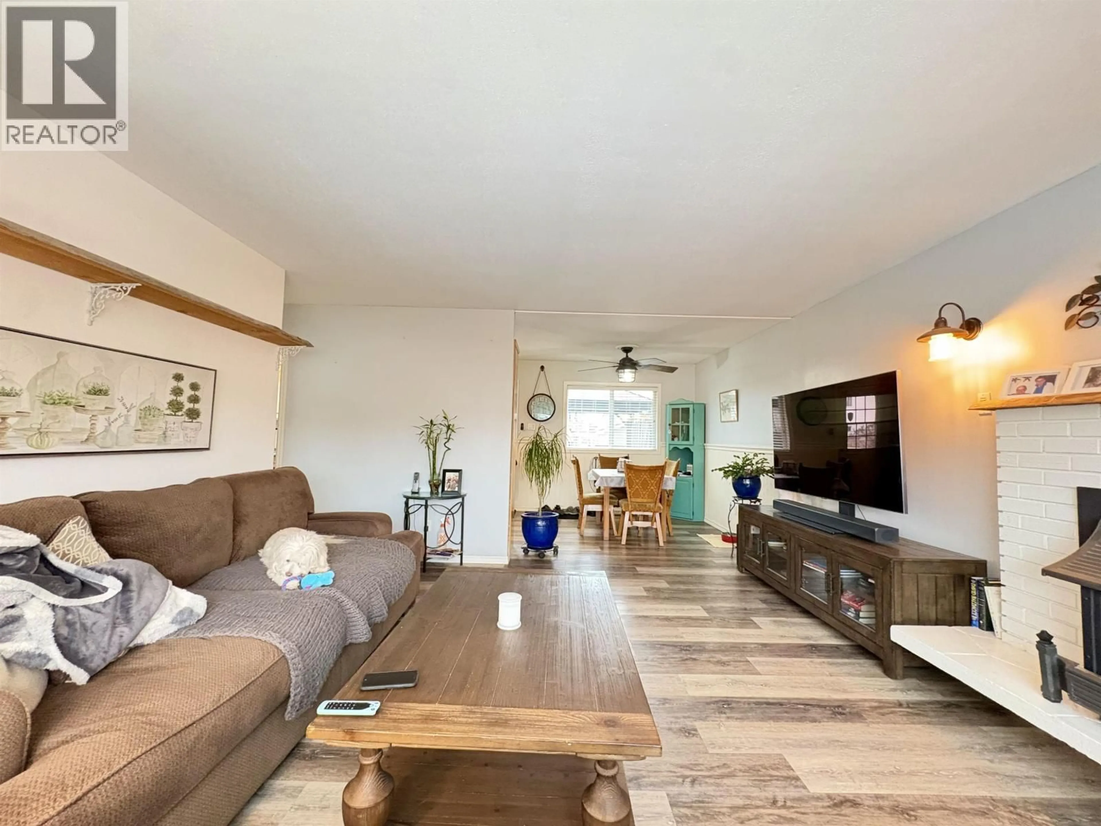 Living room with furniture, wood/laminate floor for 1443 JUBILEE AVENUE, Prince George British Columbia V2M4B3