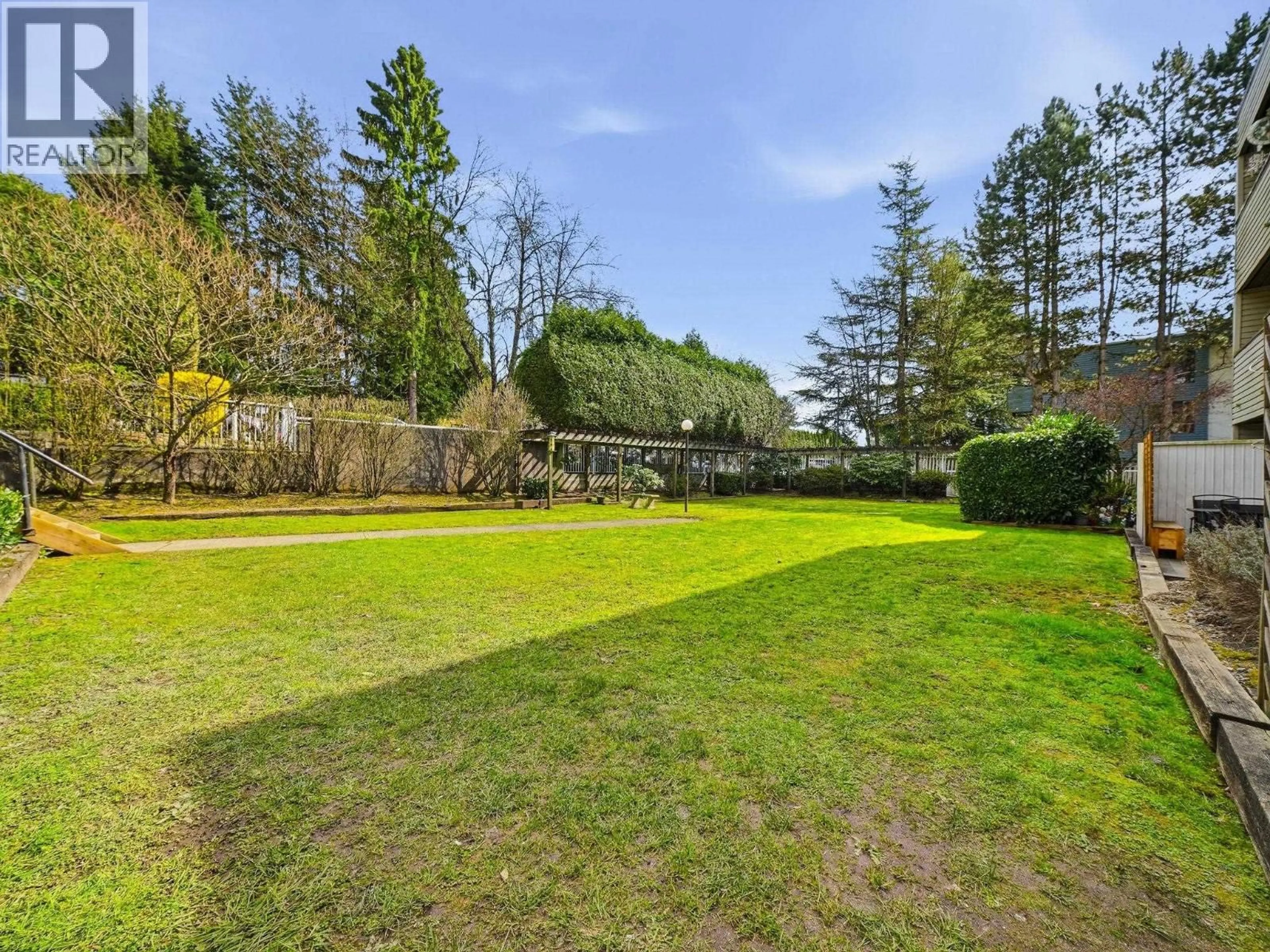 A pic from outside/outdoor area/front of a property/back of a property/a pic from drone, forest/trees view for 108 - 615 NORTH ROAD, Coquitlam British Columbia V3J1P1