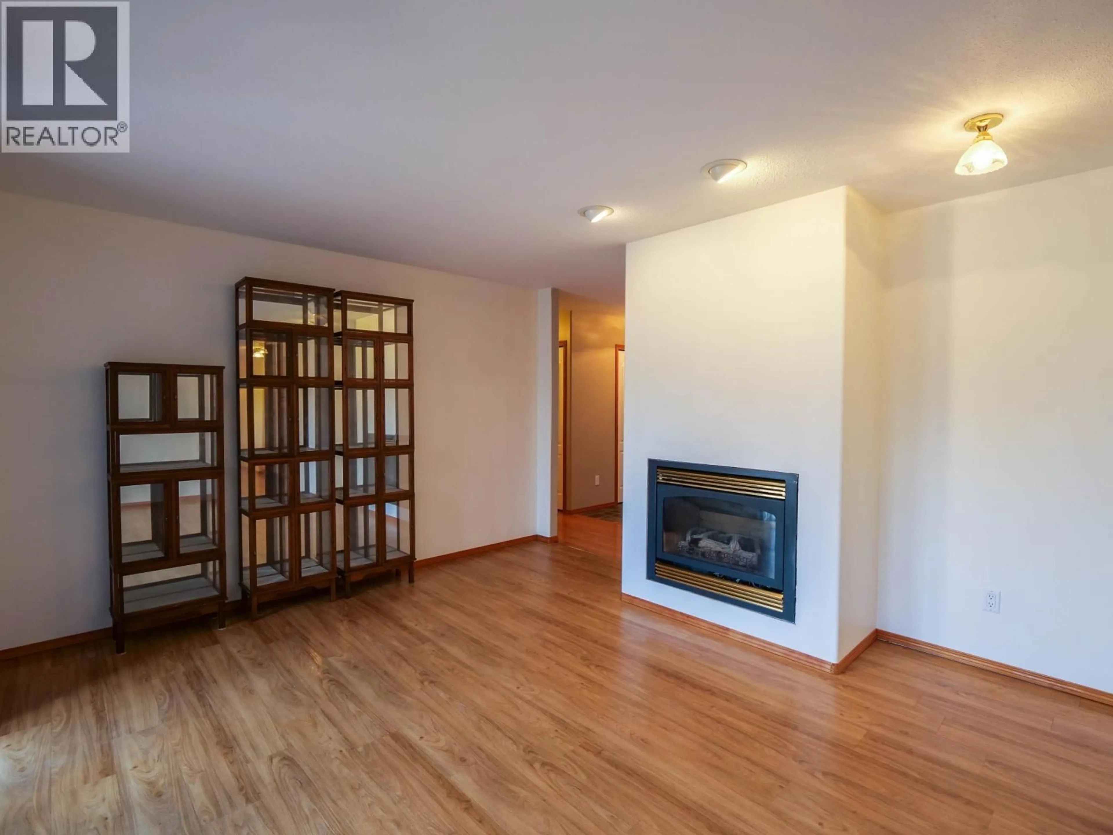 Living room with furniture, wood/laminate floor for 1889 ALMA ROAD, Quesnel British Columbia V2J6J3