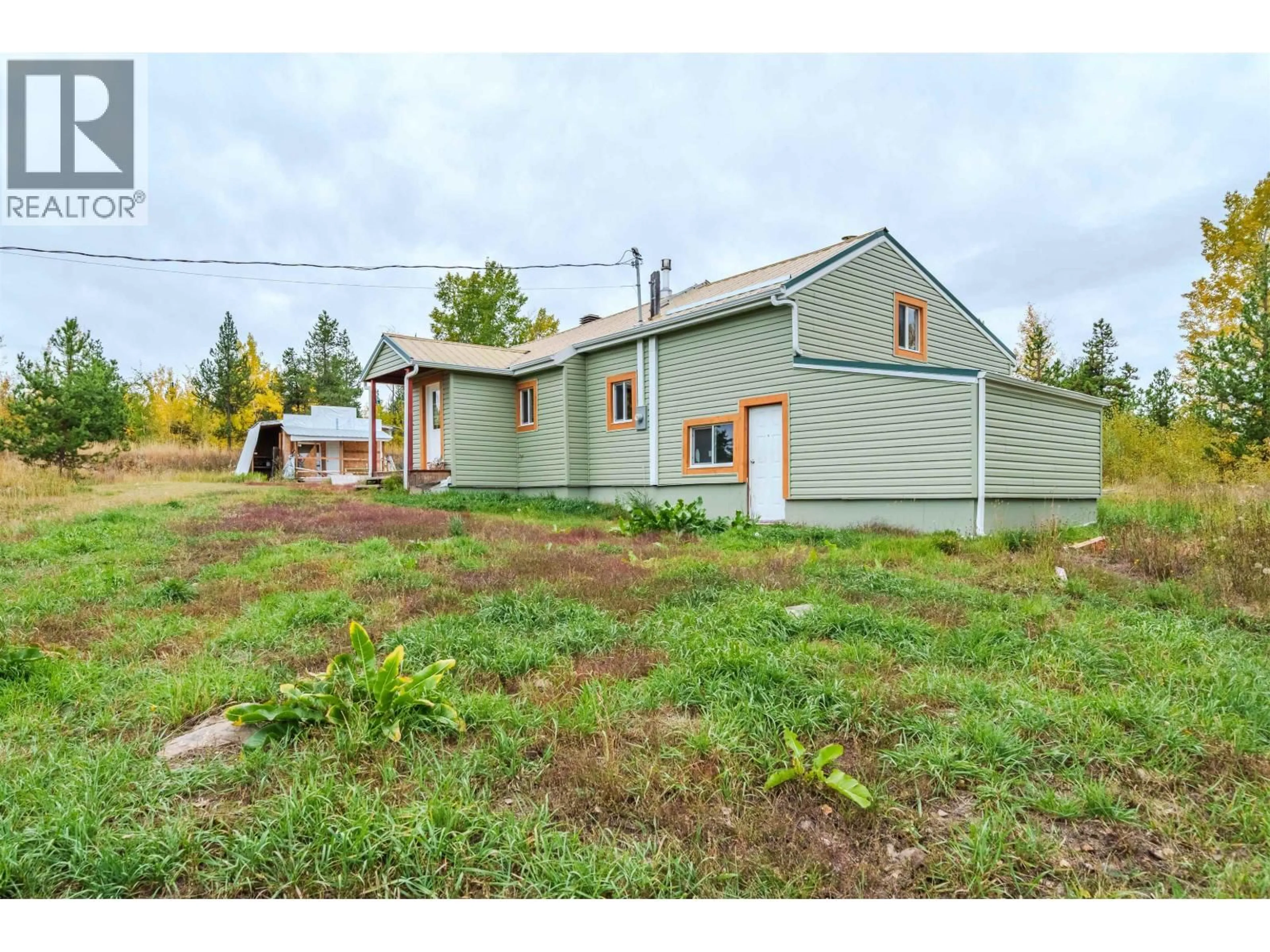 A pic from outside/outdoor area/front of a property/back of a property/a pic from drone, street for 1740 POPLAR ROAD, 70 Mile House British Columbia V0K2K0