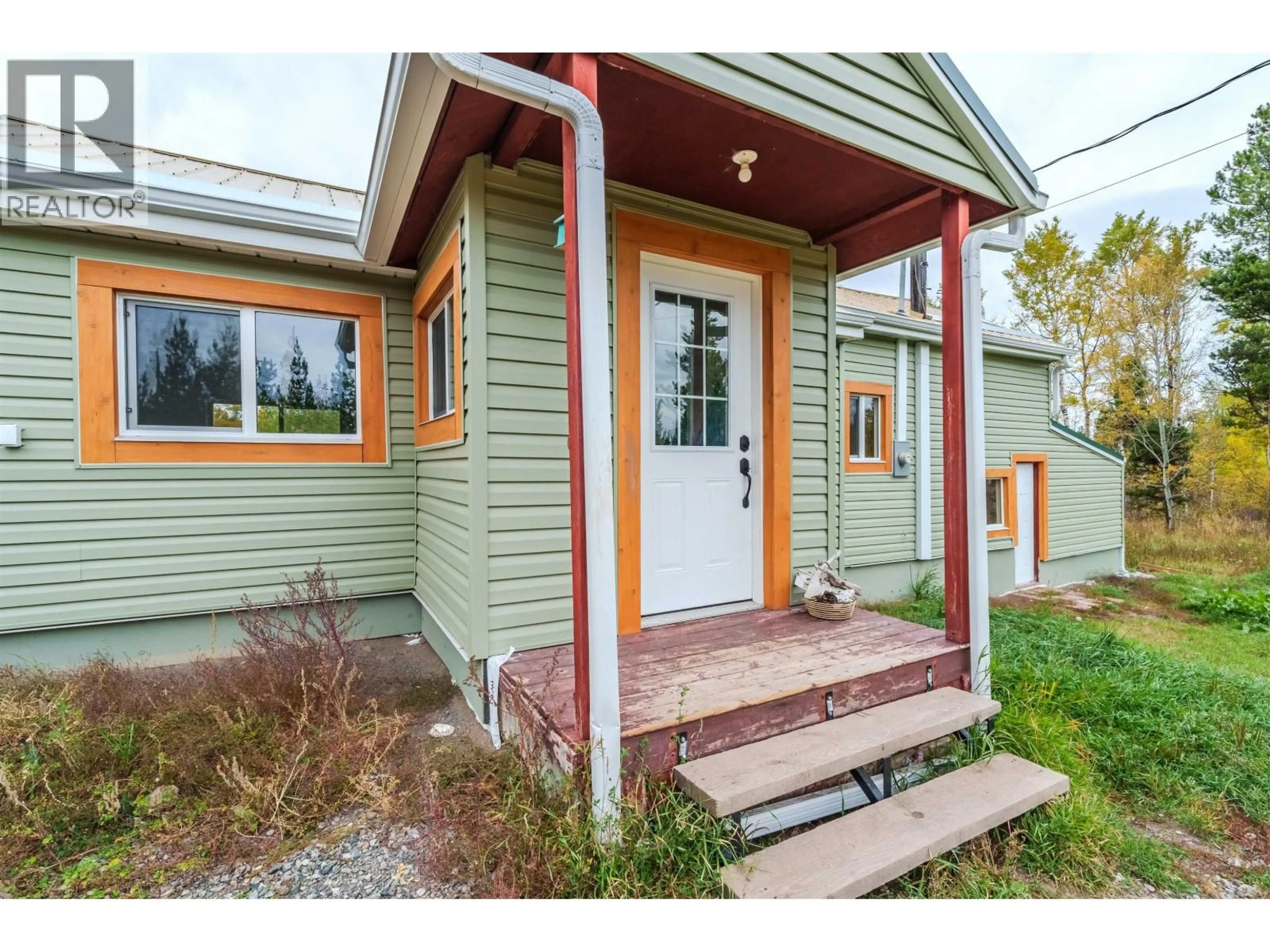 Home with vinyl exterior material, street for 1740 POPLAR ROAD, 70 Mile House British Columbia V0K2K0