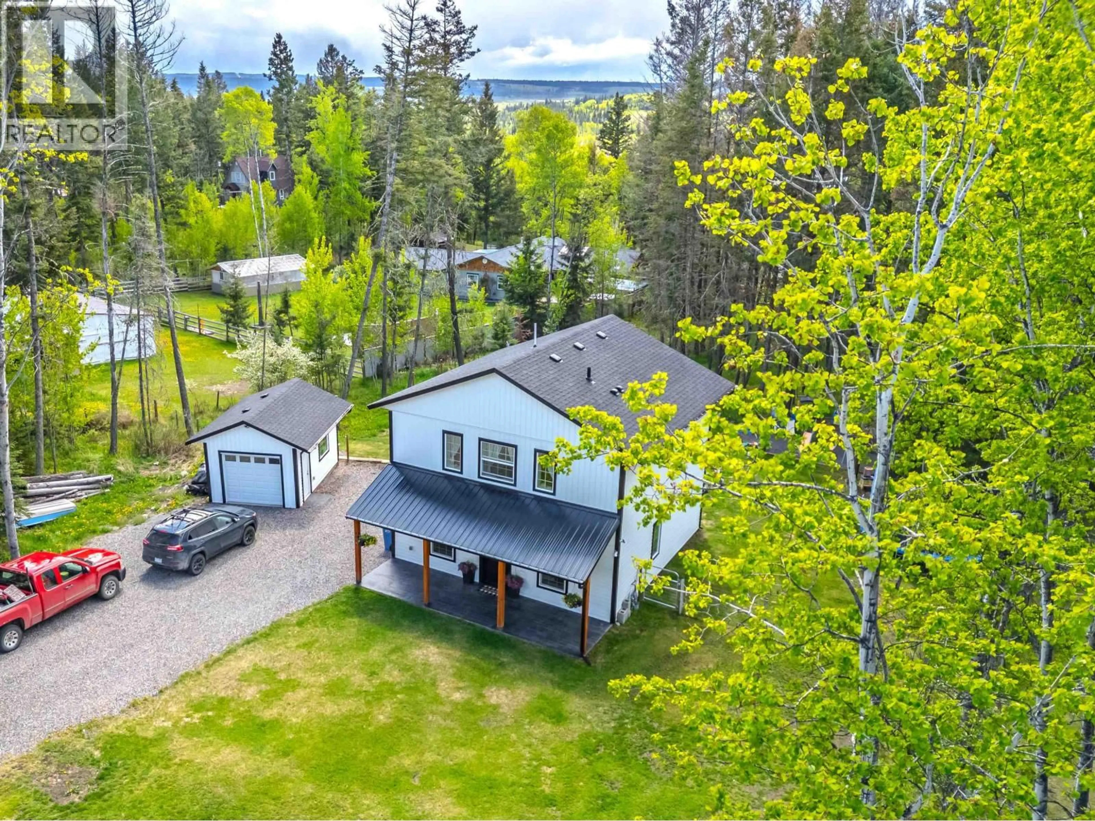 A pic from outside/outdoor area/front of a property/back of a property/a pic from drone, water/lake/river/ocean view for 4908 KITWANGA DRIVE, 108 Mile Ranch British Columbia V0K2Z0