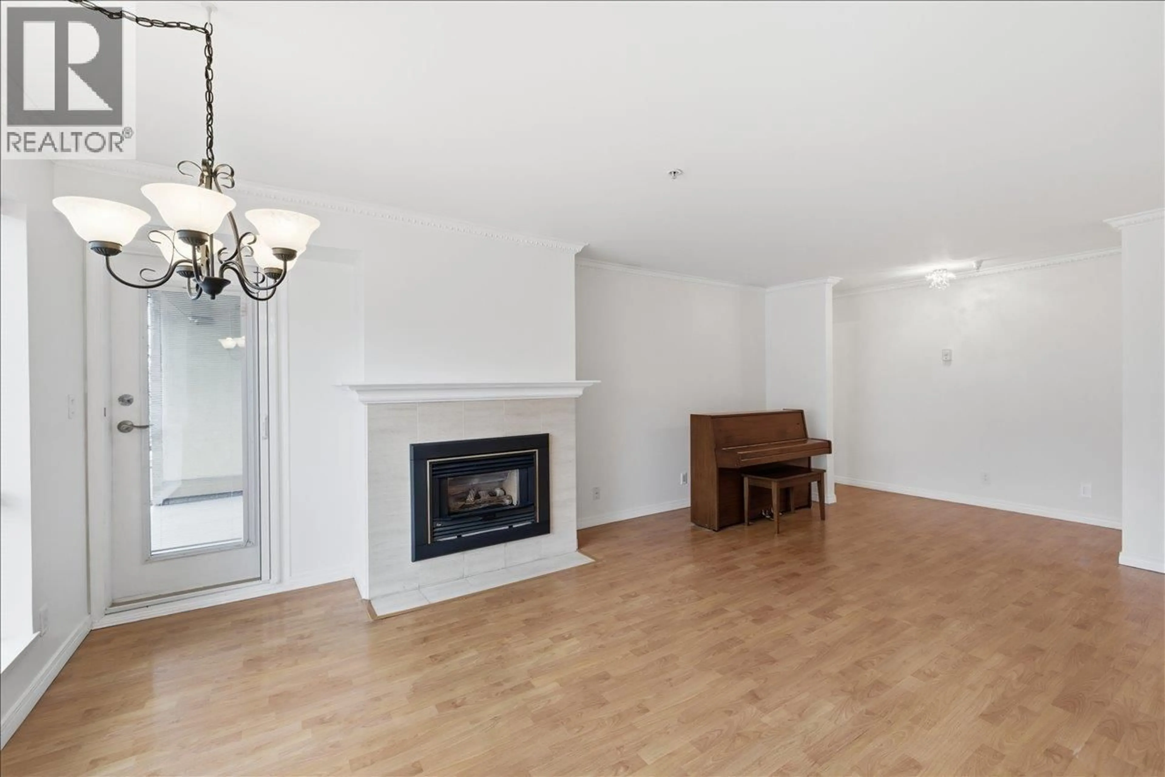 Living room with furniture, wood/laminate floor for 201 - 3290 4TH AVENUE, Vancouver British Columbia V6K1R9