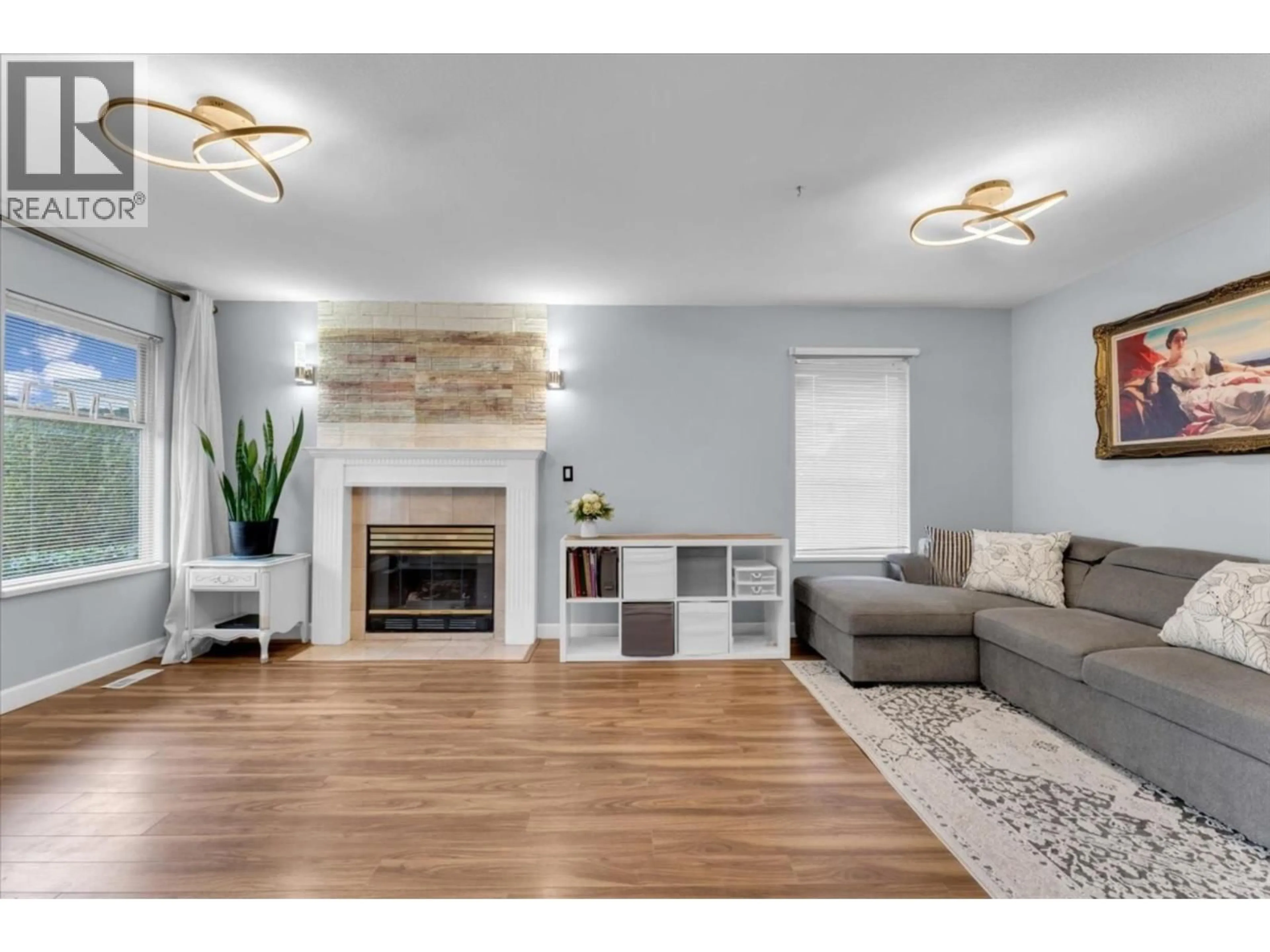 Living room with furniture, wood/laminate floor for 3 - 6675 NO. 2 ROAD, Richmond British Columbia V7C3L5