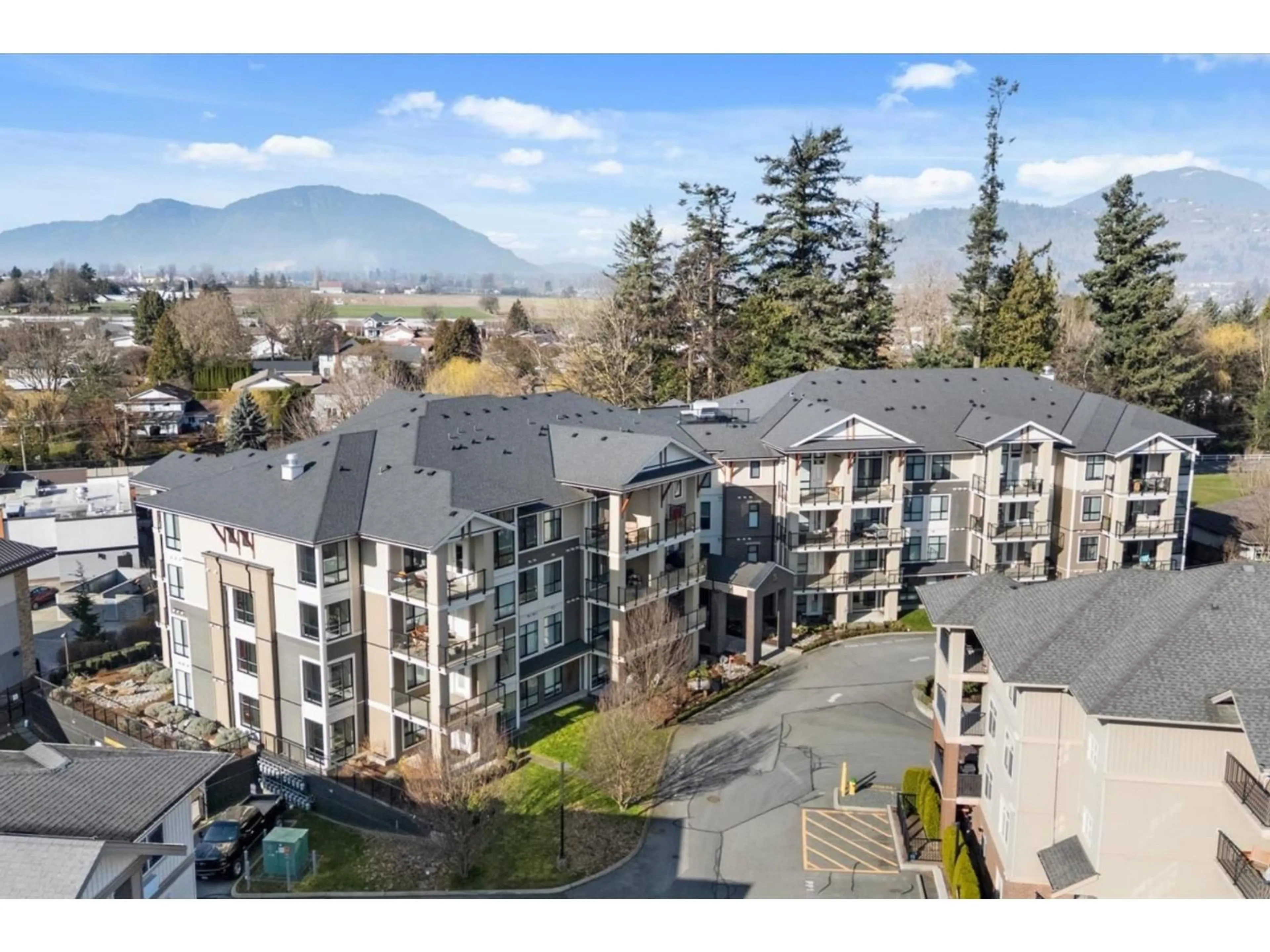 A pic from outside/outdoor area/front of a property/back of a property/a pic from drone, mountain view for 102 - 45761 STEVENSON ROAD, Chilliwack British Columbia V2R0Y7