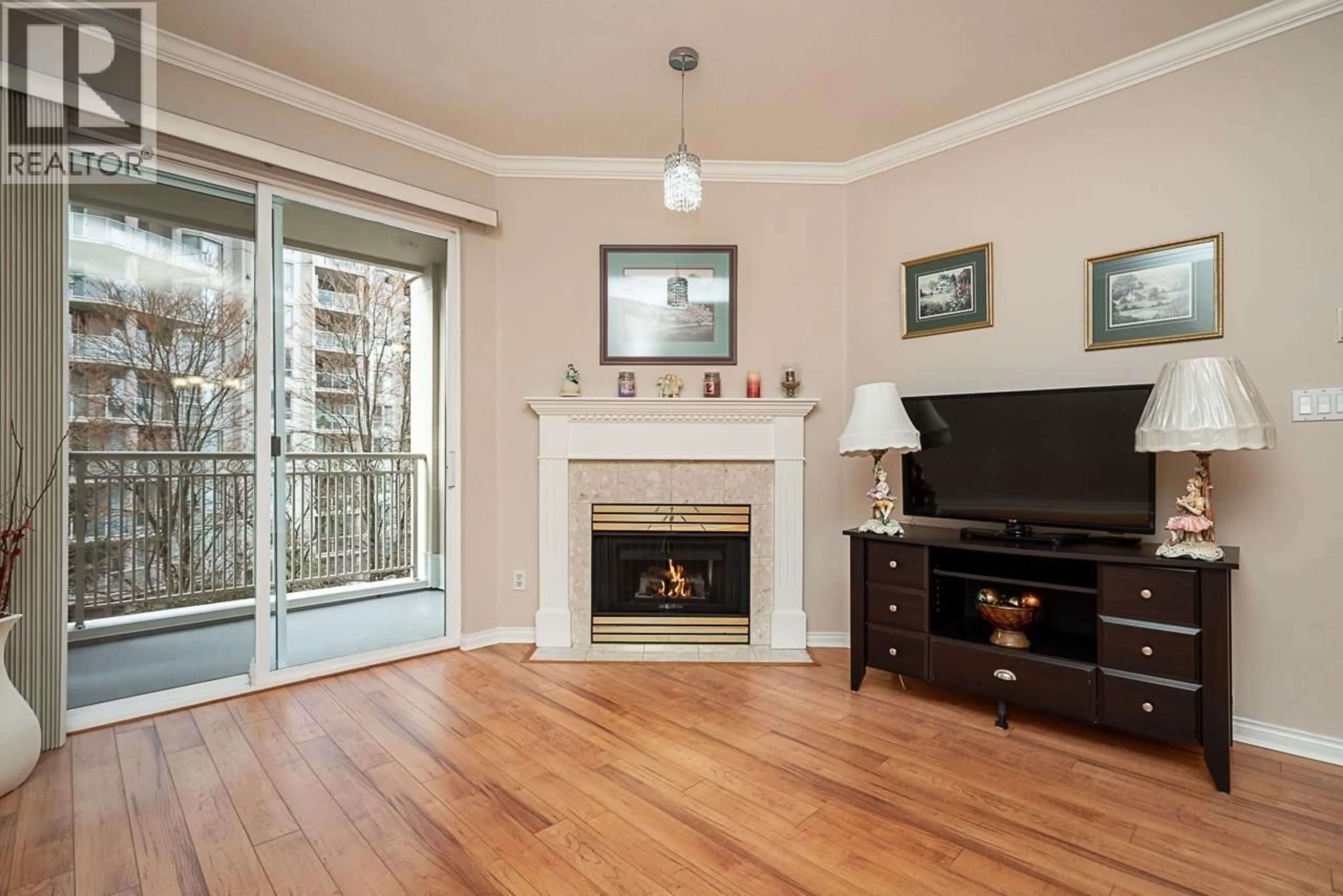 Living room with furniture, wood/laminate floor for 313 - 3098 GUILDFORD WAY, Coquitlam British Columbia V3B7W8