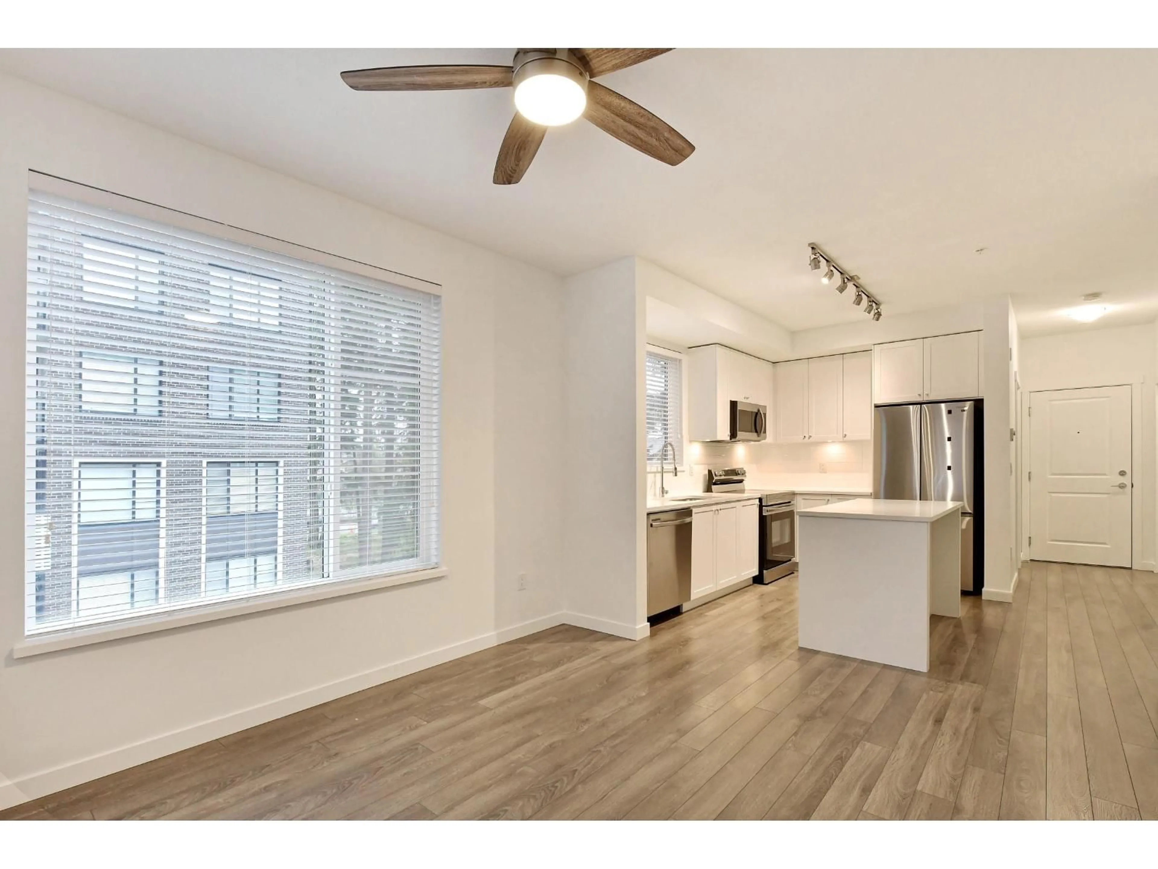 Open concept kitchen, wood/laminate floor for 308 - 15835 85 AVENUE, Surrey British Columbia V4N6W6