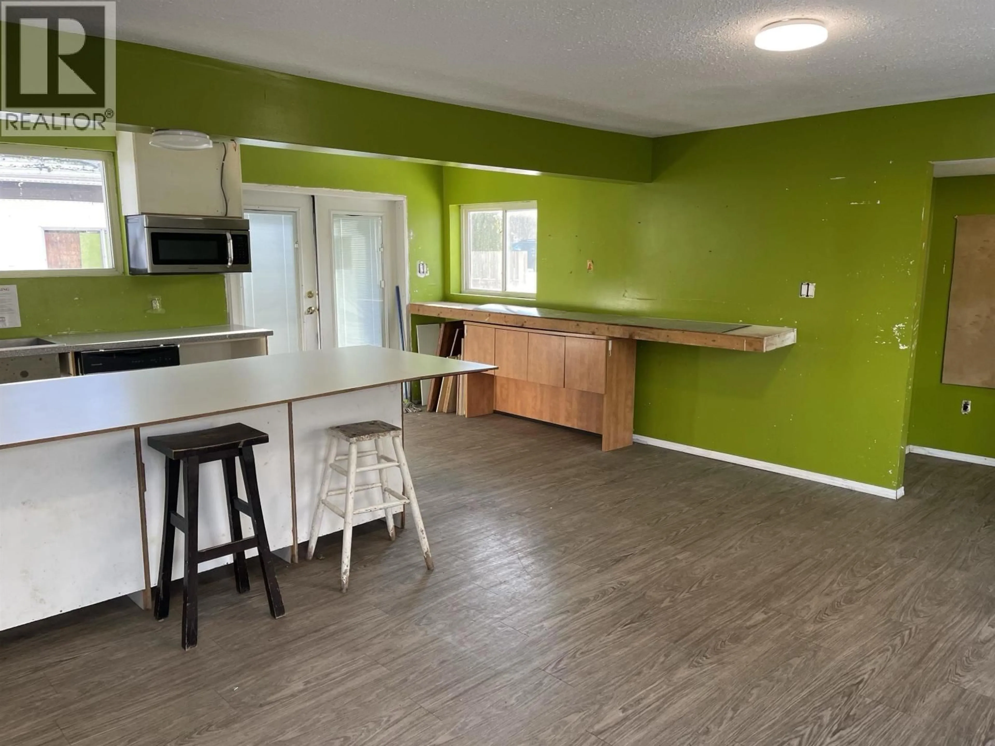 Open concept kitchen, wood/laminate floor for 4526 OLSON AVENUE, Terrace British Columbia V8G2A1