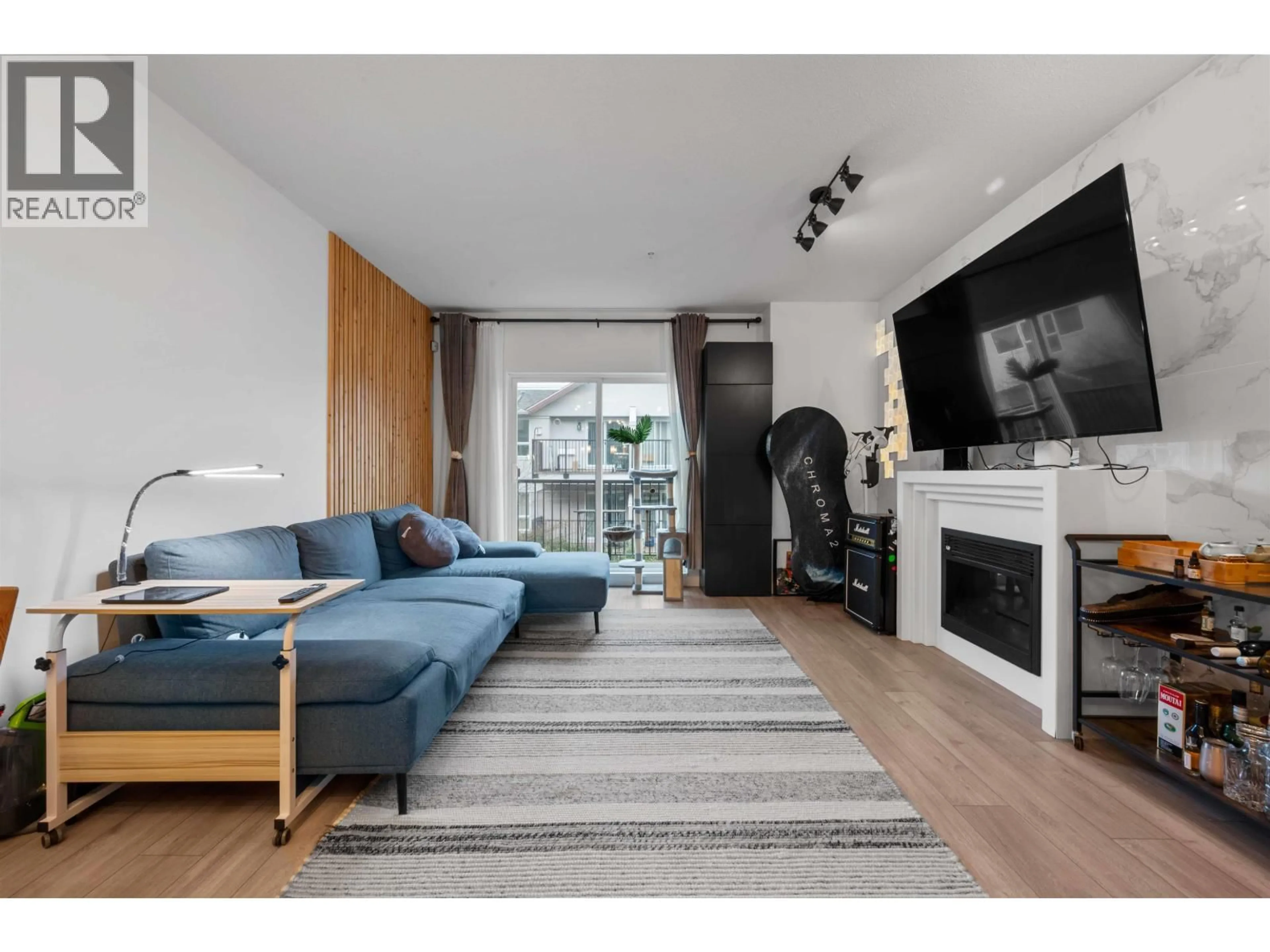 Living room with furniture, wood/laminate floor for 225 - 3888 NORFOLK STREET, Burnaby British Columbia V5G1E5