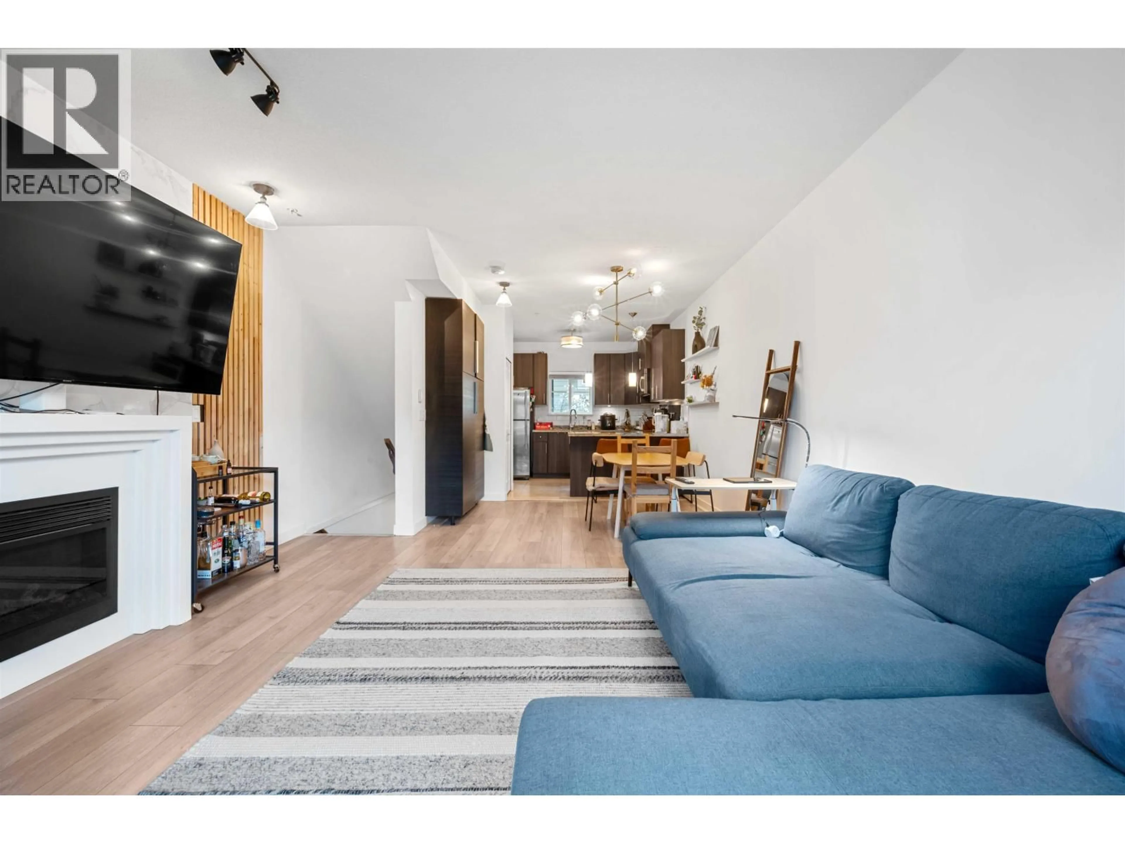 Living room with furniture, wood/laminate floor for 225 - 3888 NORFOLK STREET, Burnaby British Columbia V5G1E5