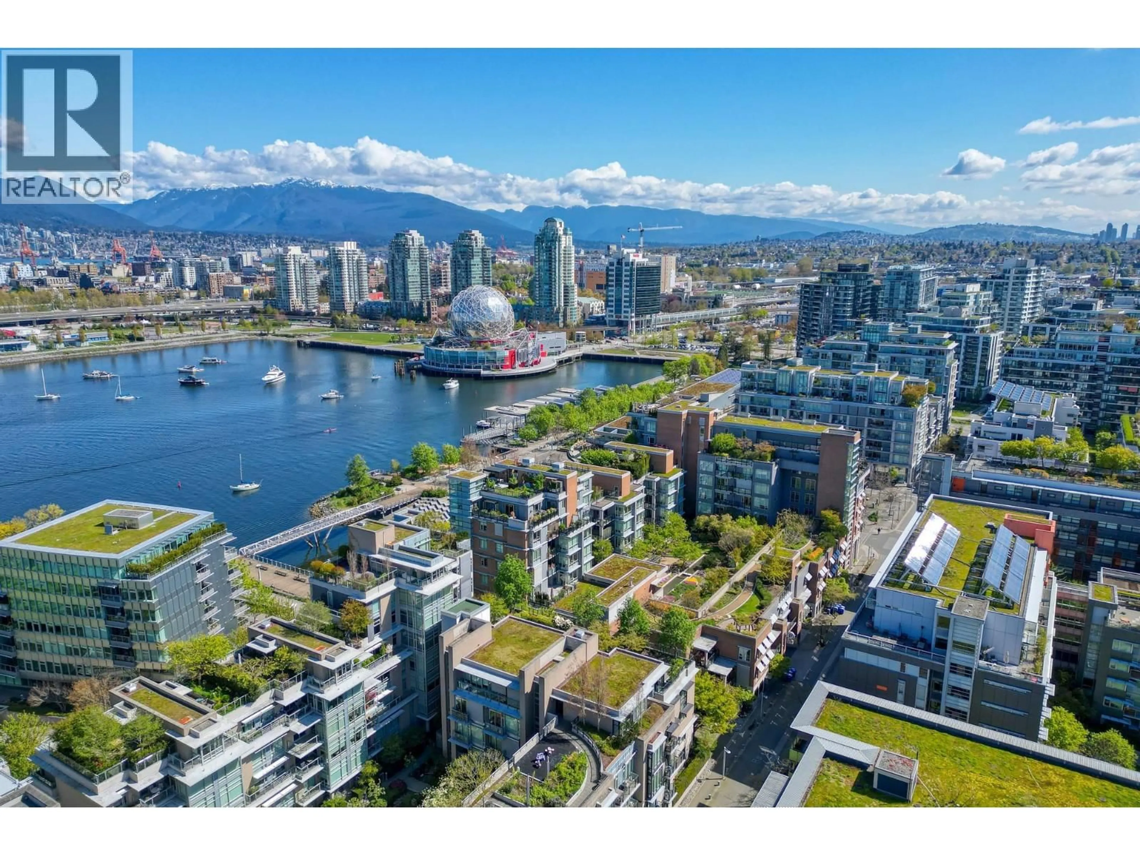 A pic from outside/outdoor area/front of a property/back of a property/a pic from drone, water/lake/river/ocean view for 102 - 128 ATHLETES WAY, Vancouver British Columbia V5Y0B5