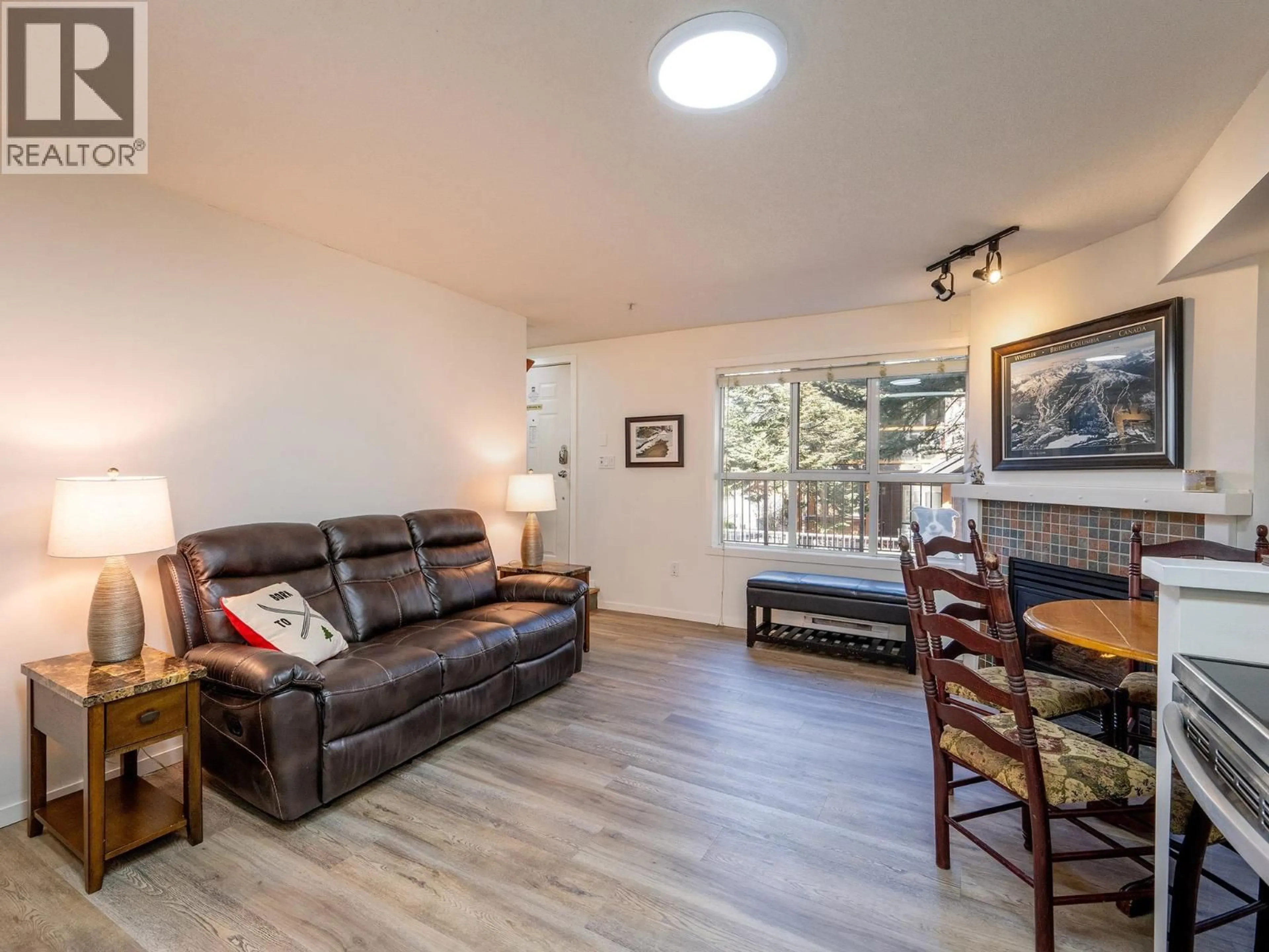 Living room with furniture, wood/laminate floor for 3 - 4388 NORTHLANDS BOULEVARD, Whistler British Columbia V8E1C6