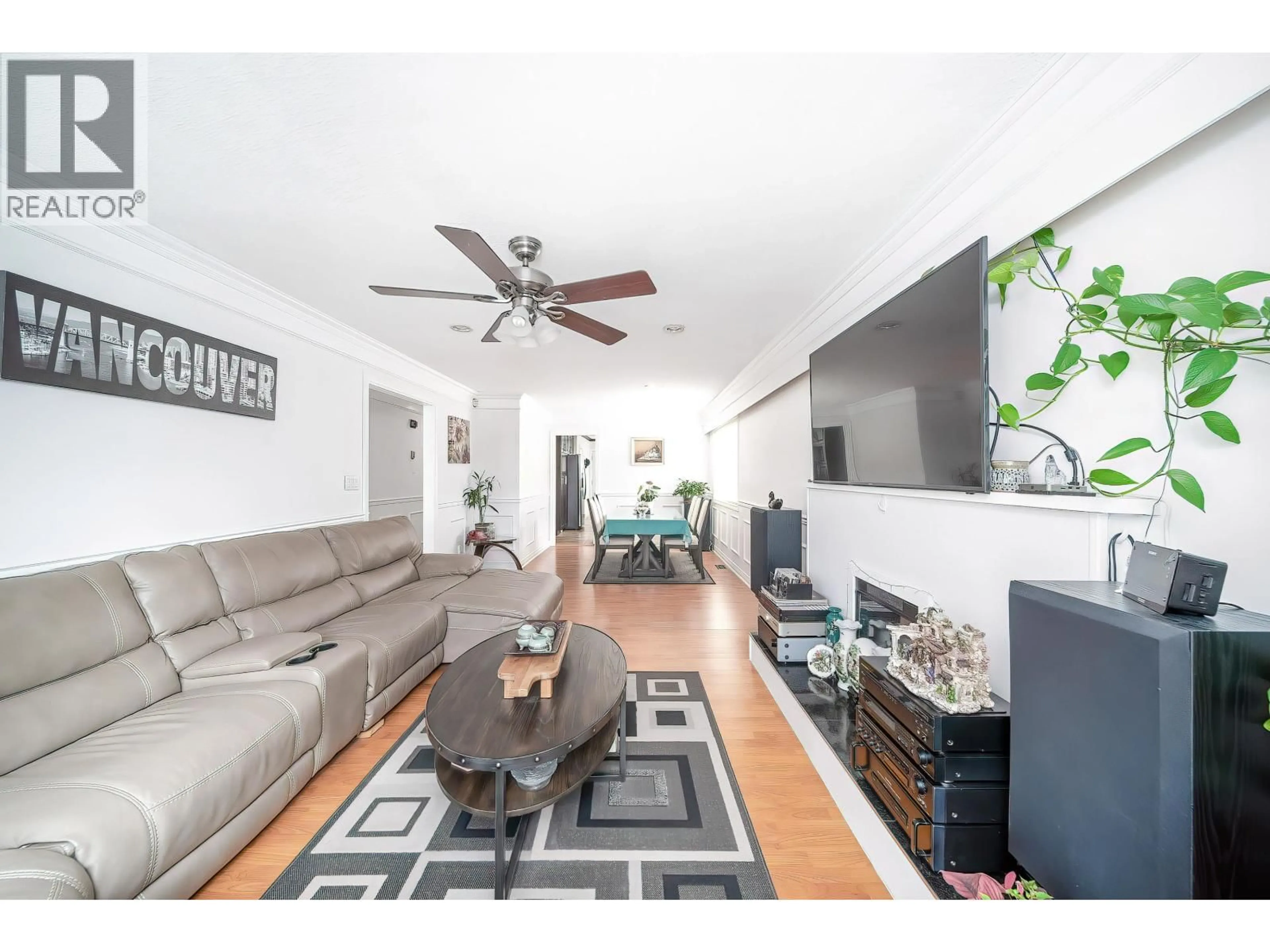 Living room with furniture, wood/laminate floor for 6626 INVERNESS STREET, Vancouver British Columbia V5X4E9