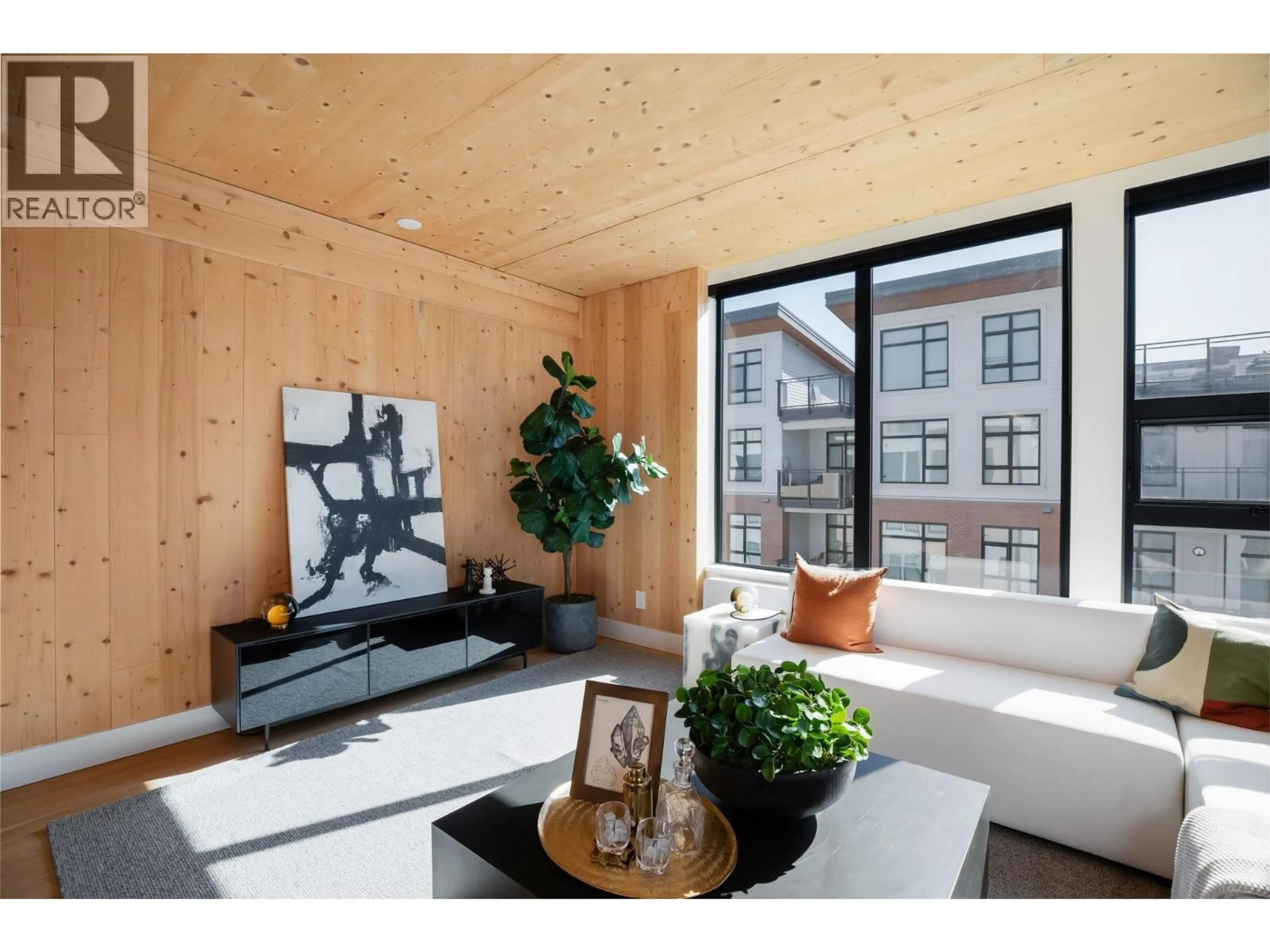 Living room with furniture, wood/laminate floor for 414 - 310 SALTER STREET, New Westminster British Columbia V3M0N7