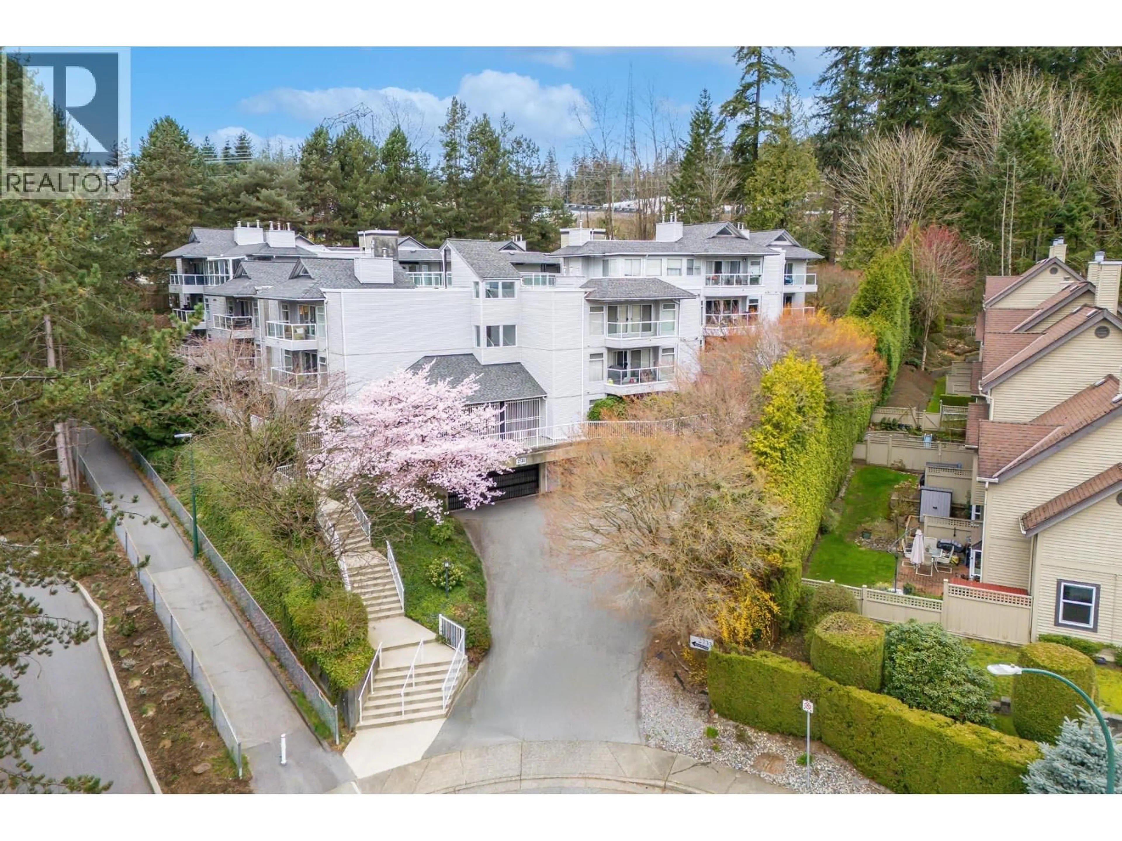 A pic from outside/outdoor area/front of a property/back of a property/a pic from drone, unknown for 203 - 2733 ATLIN PLACE, Coquitlam British Columbia V3C5B1