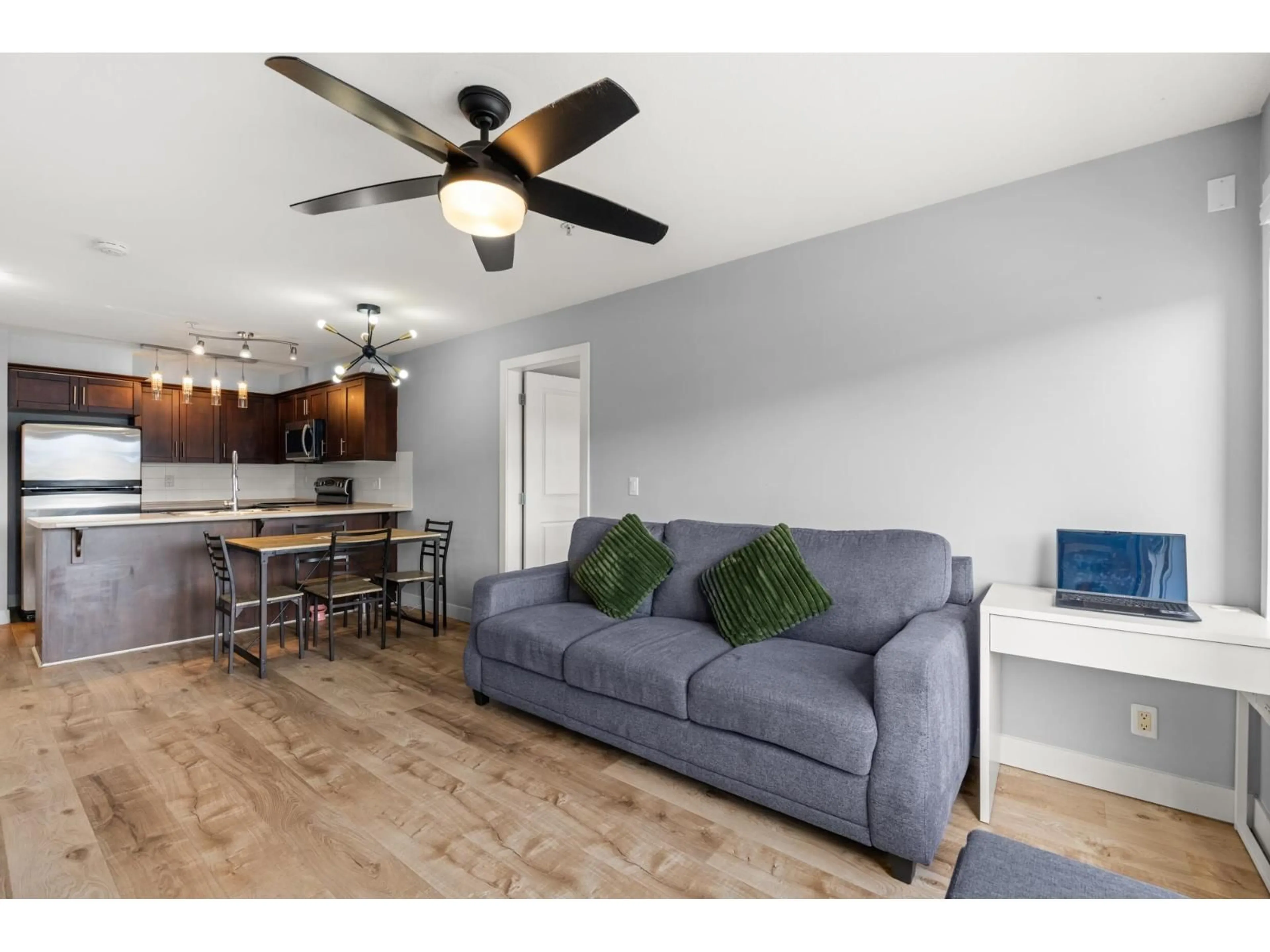 Living room with furniture, wood/laminate floor for 312 - 46289 YALE ROAD, Chilliwack British Columbia V2P0B9