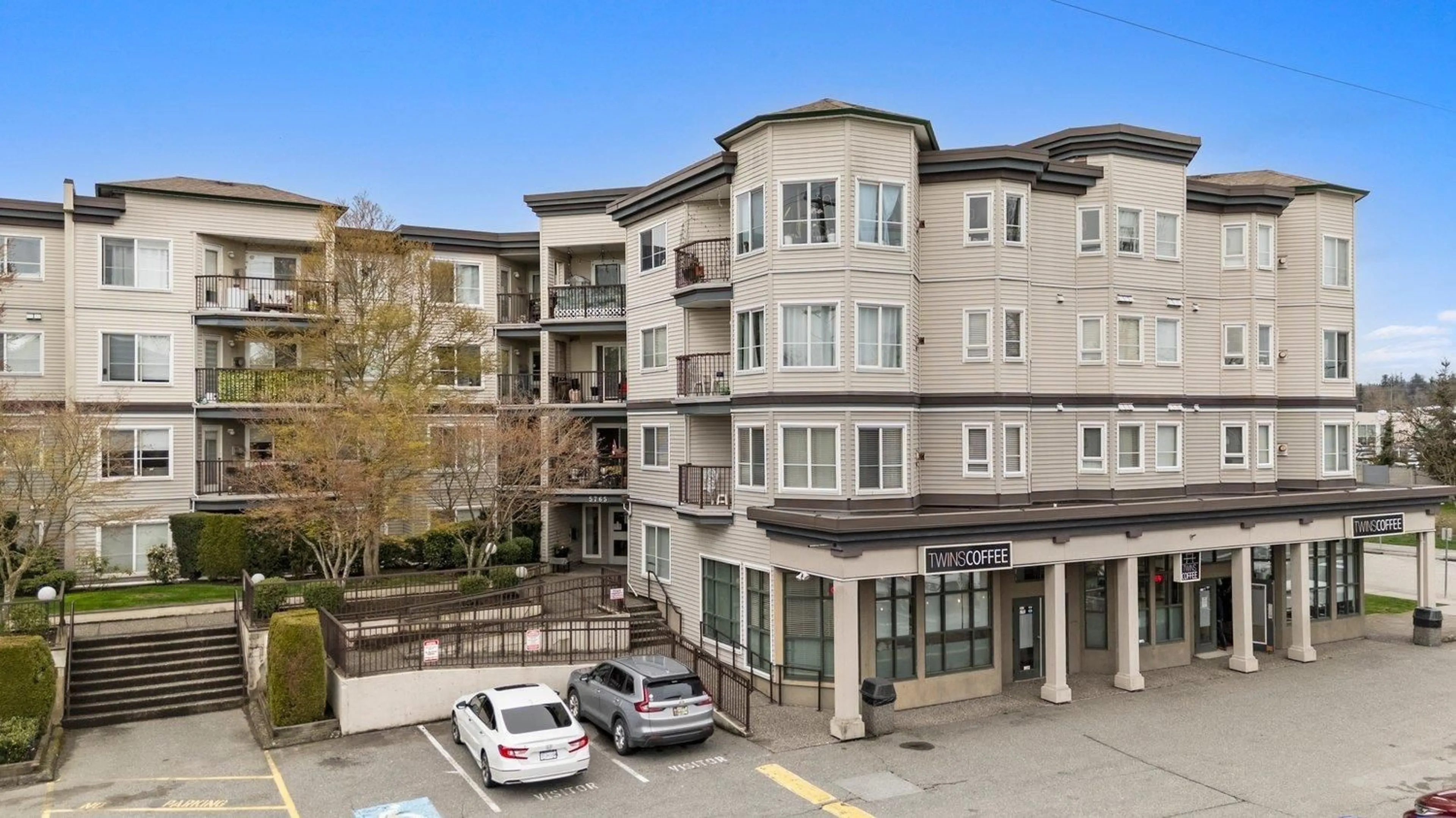 A pic from outside/outdoor area/front of a property/back of a property/a pic from drone, city buildings view from balcony for 210 - 5765 GLOVER ROAD, Langley British Columbia V3A8M8