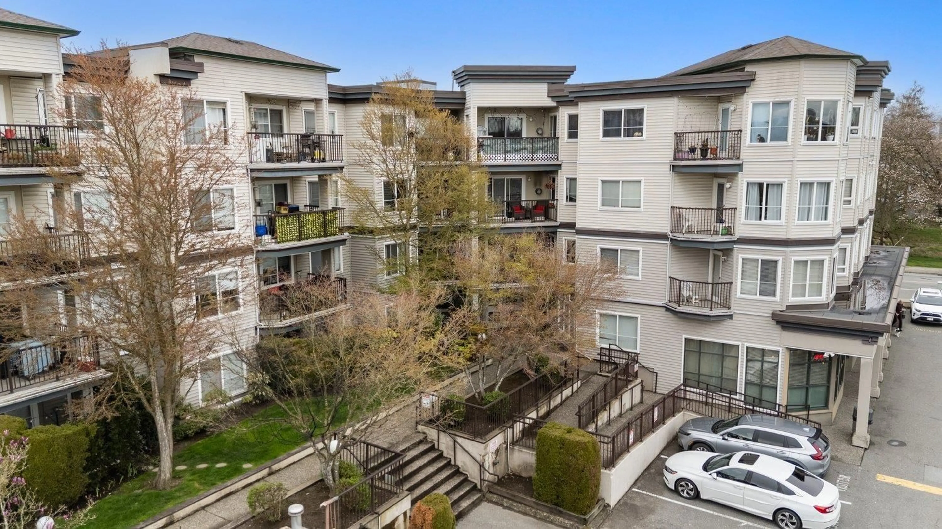 A pic from outside/outdoor area/front of a property/back of a property/a pic from drone, city buildings view from balcony for 210 - 5765 GLOVER ROAD, Langley British Columbia V3A8M8