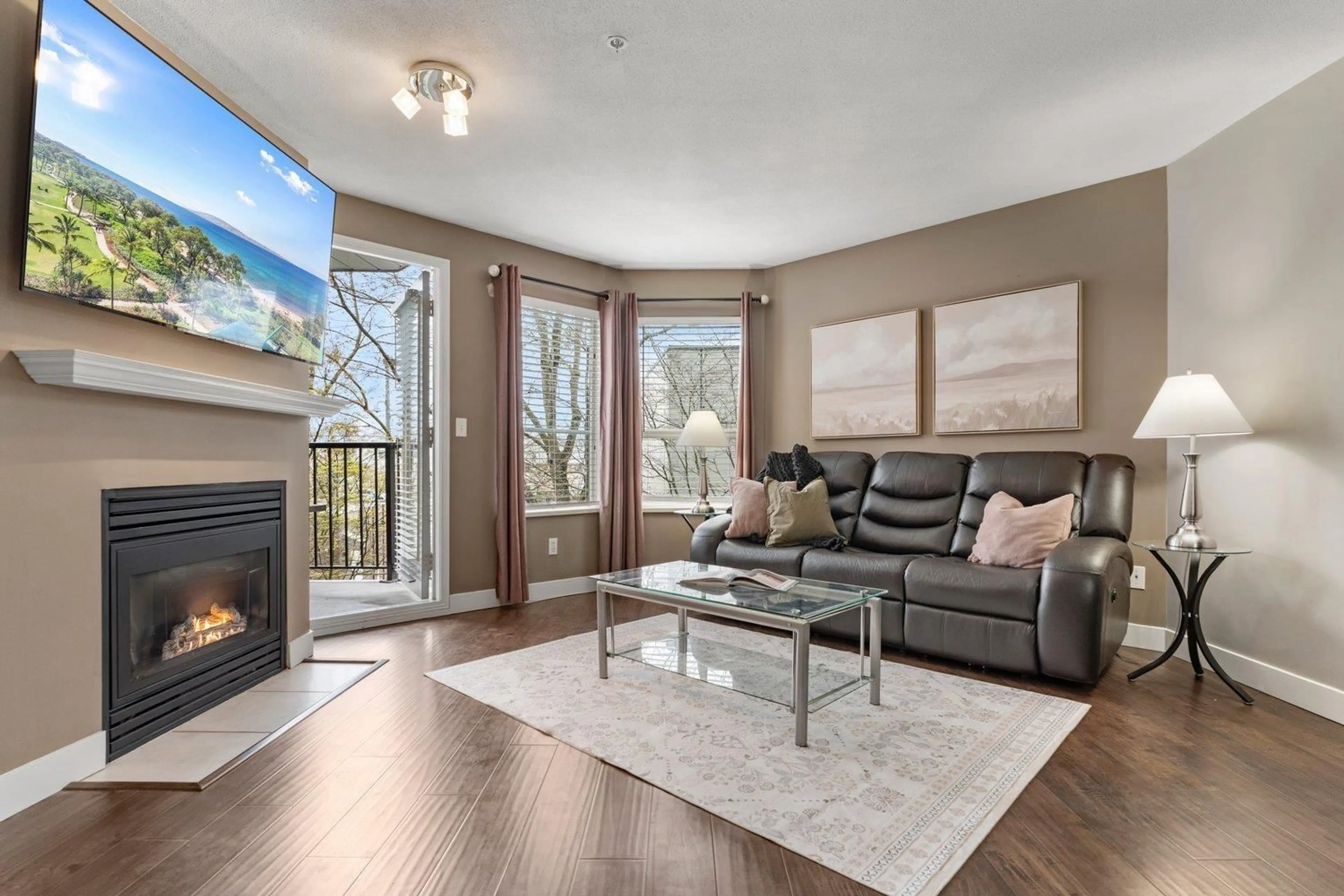 Living room with furniture, wood/laminate floor for 210 - 5765 GLOVER ROAD, Langley British Columbia V3A8M8