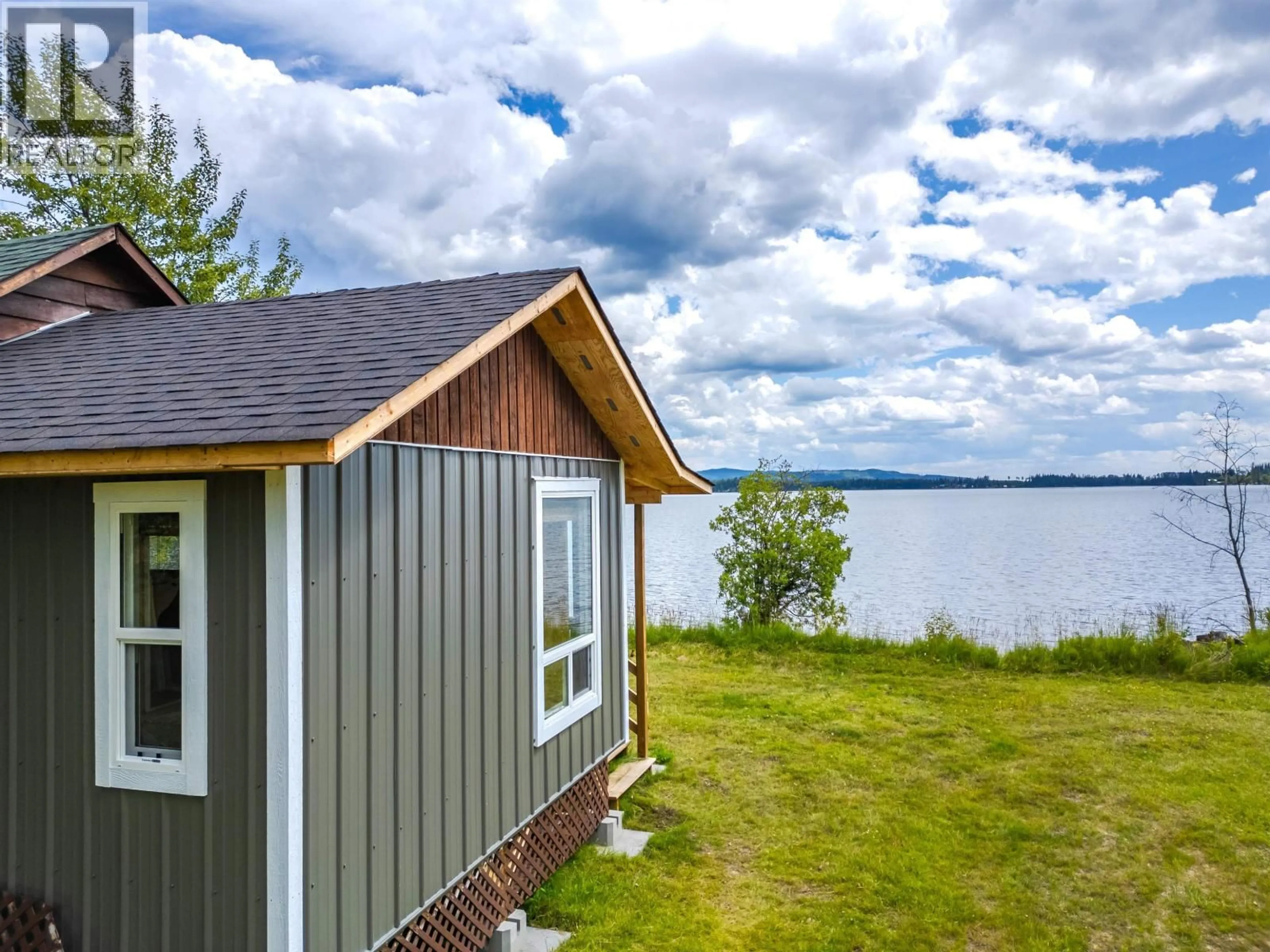 Home with vinyl exterior material, water/lake/river/ocean view for 4778 BINNIE ROAD, Lac La Hache British Columbia V0K1T0