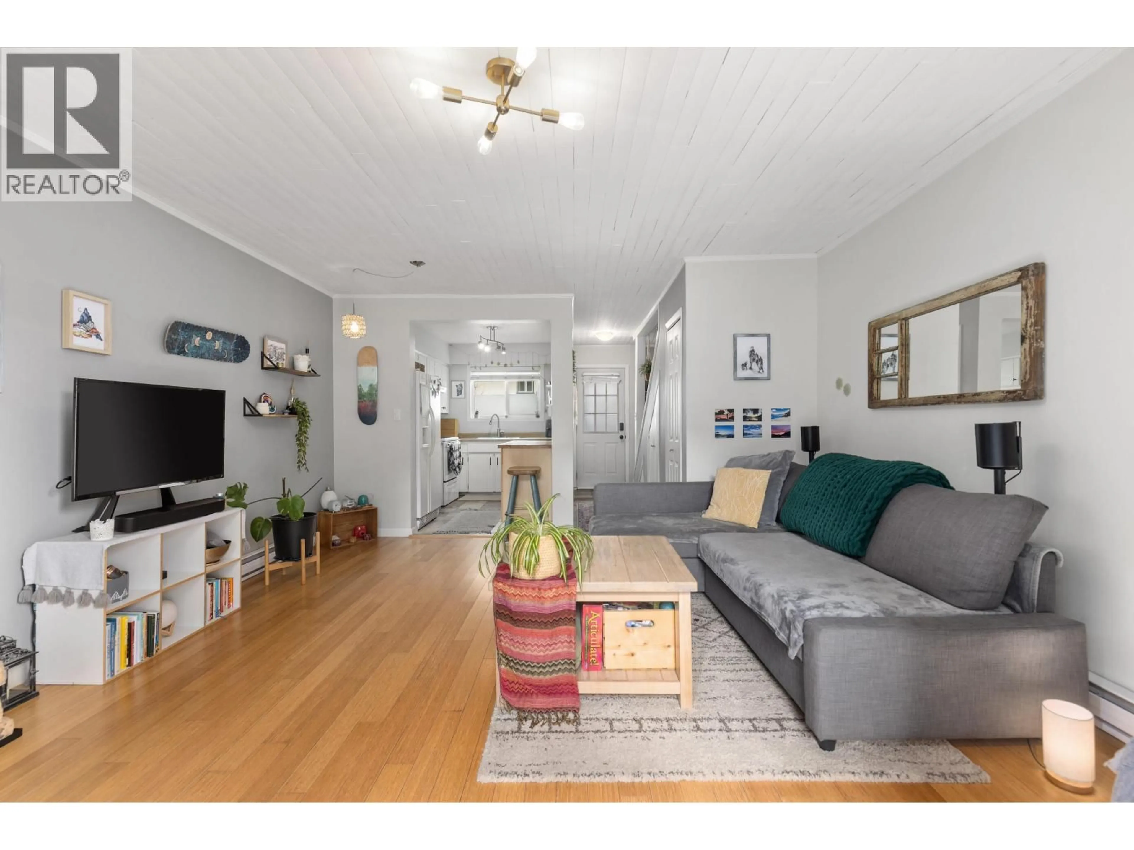 Living room with furniture, wood/laminate floor for 13 - 1470 LAUREL STREET, Pemberton British Columbia V0N2L1