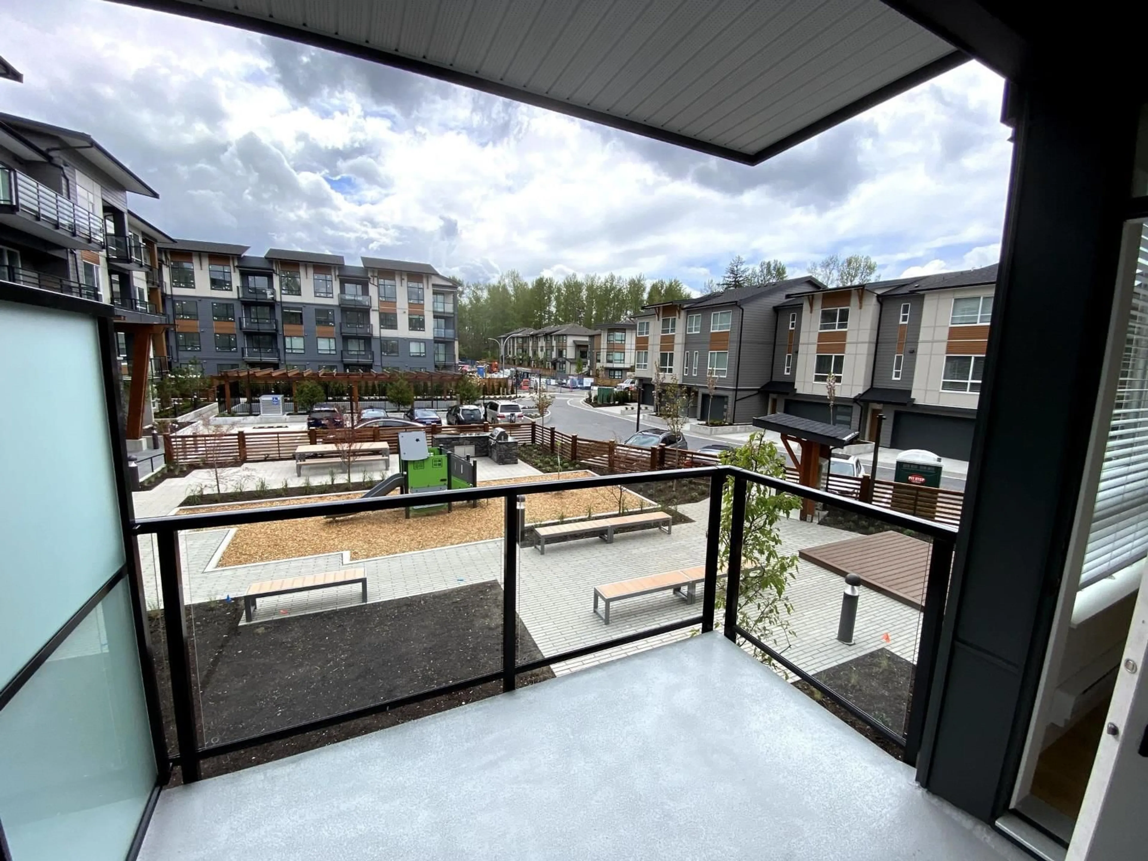 Patio, city buildings view from balcony for 206 - 19935 75A AVENUE, Langley British Columbia V2Y4L6